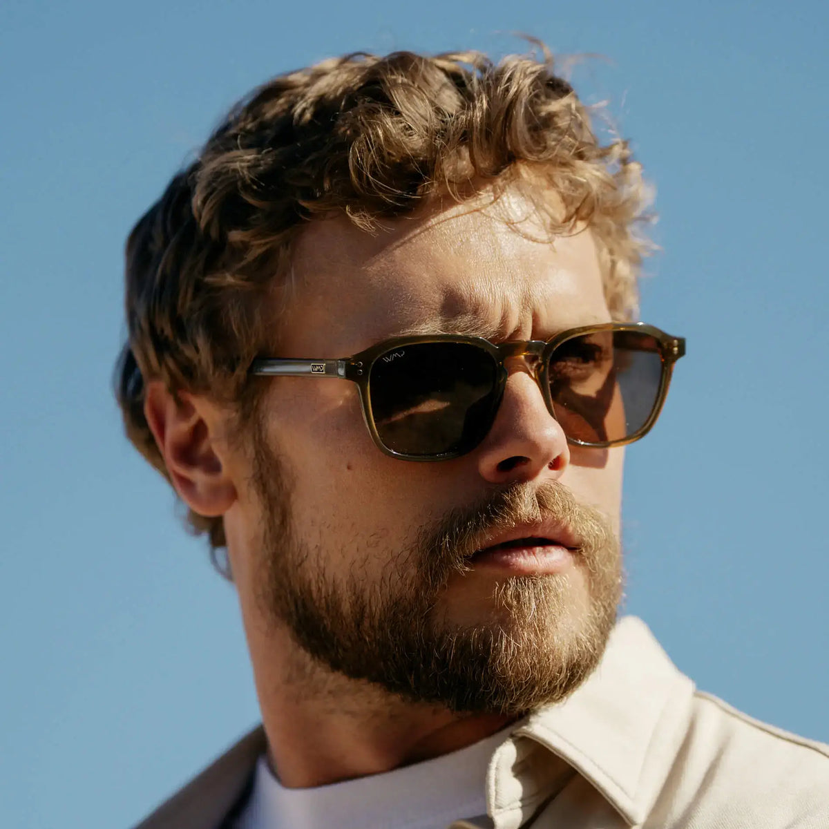 Crystal Verde / Amber || Model wearing Men's Square Prescription Sunglasses with Crystal Verde Frame and Amber Lens