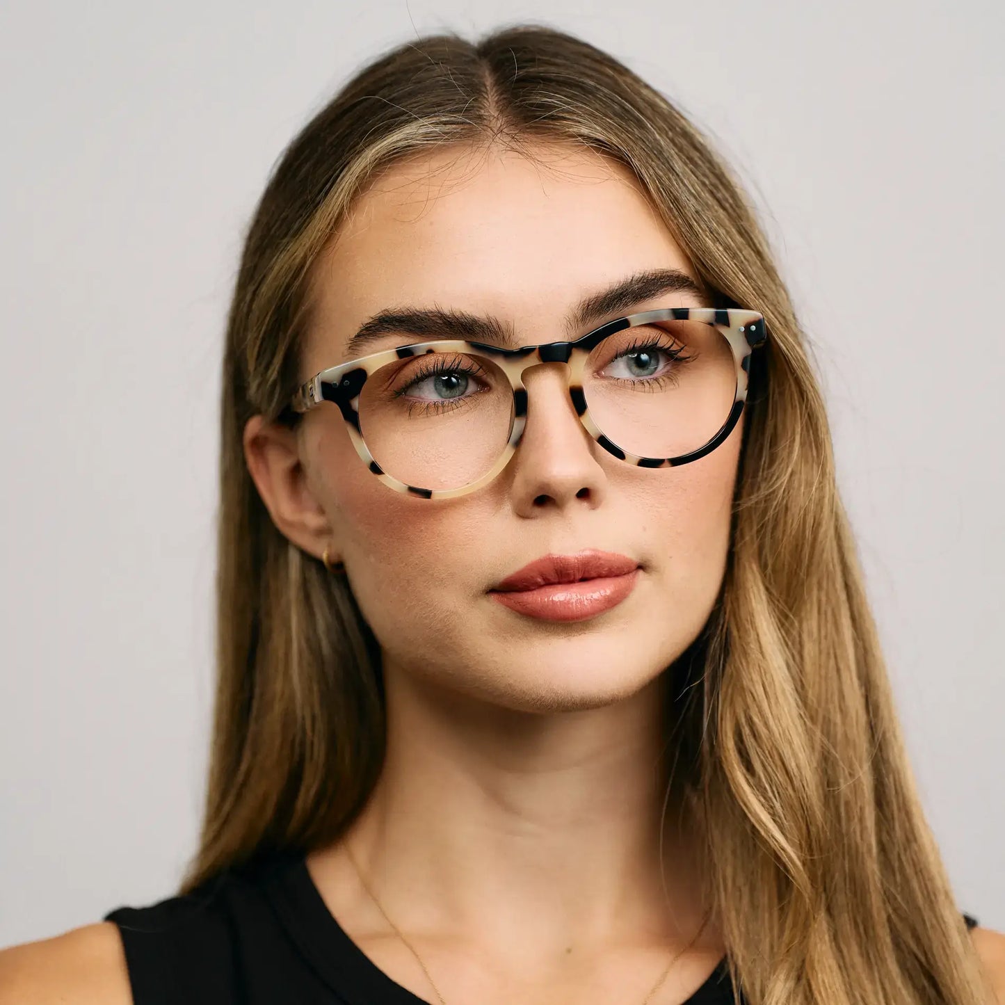 Beige Tortoise || Round acetate prescription eyeglasses with subtle beige tortoise pattern frame worn by woman indoors
