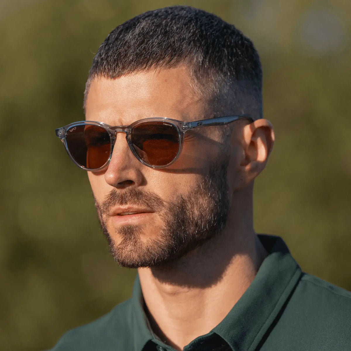 Denim Blue / Amber || Round prescription sunglasses with denim blue acetate frame and brown lenses worn outdoors by man