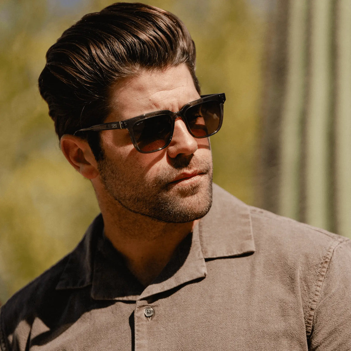 Smoke Grey / Amber || Model wearing Men's Thick Square Prescription Sunglasses with Smoke Grey Acetate Frame and Amber Lens