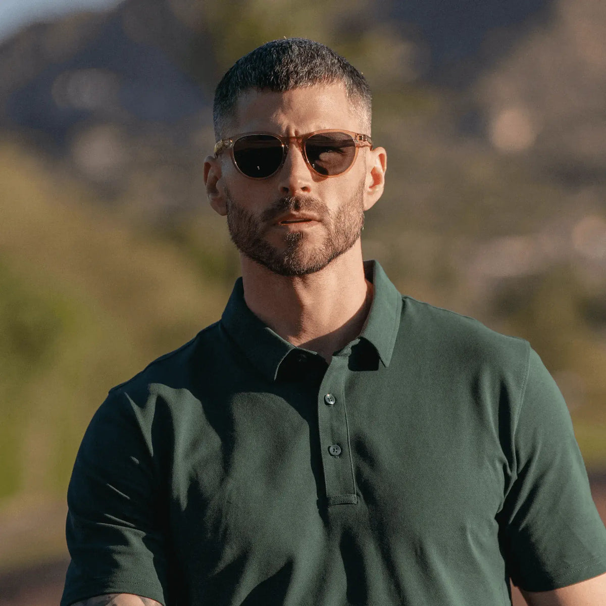 Iris Yellow / Grey || Modern square prescription sunglasses with iris yellow frame and grey lenses worn by man outdoors