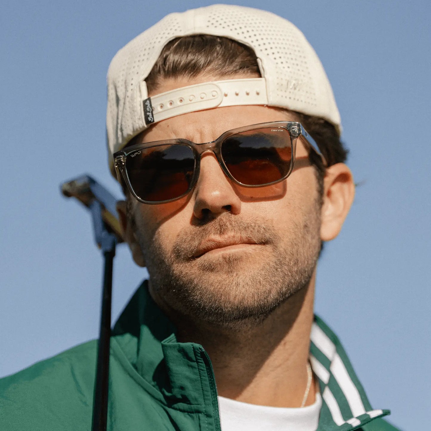 Crystal Agave Green / Amber || Model wearing Men's Geometric Rectangular Prescription Sunglasses with Crystal Agave Green Acetate Frame and Amber Lens