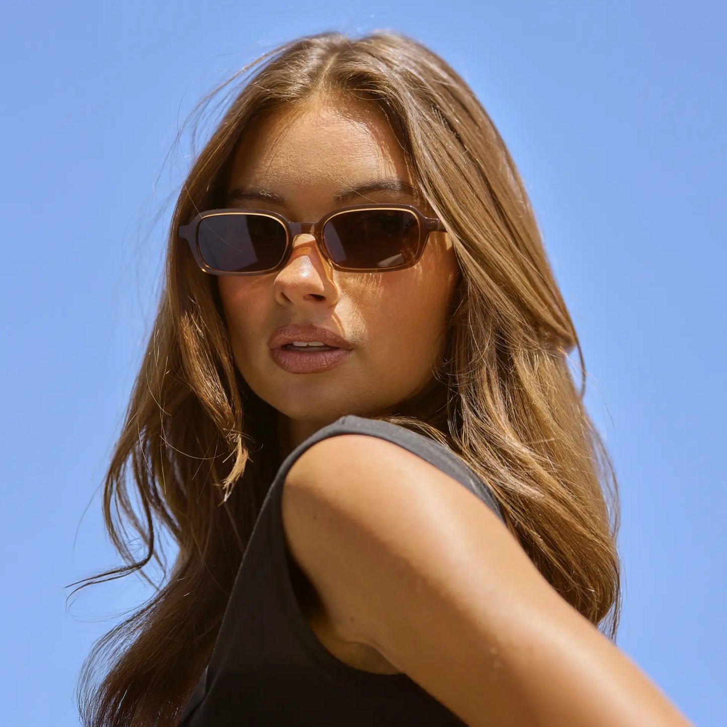 Cocoa Brown / Brown Lens || Model wearing Women's Rectangular Sunglasses with Cocoa Brown Frame and Anti-Reflective Brown Lenses