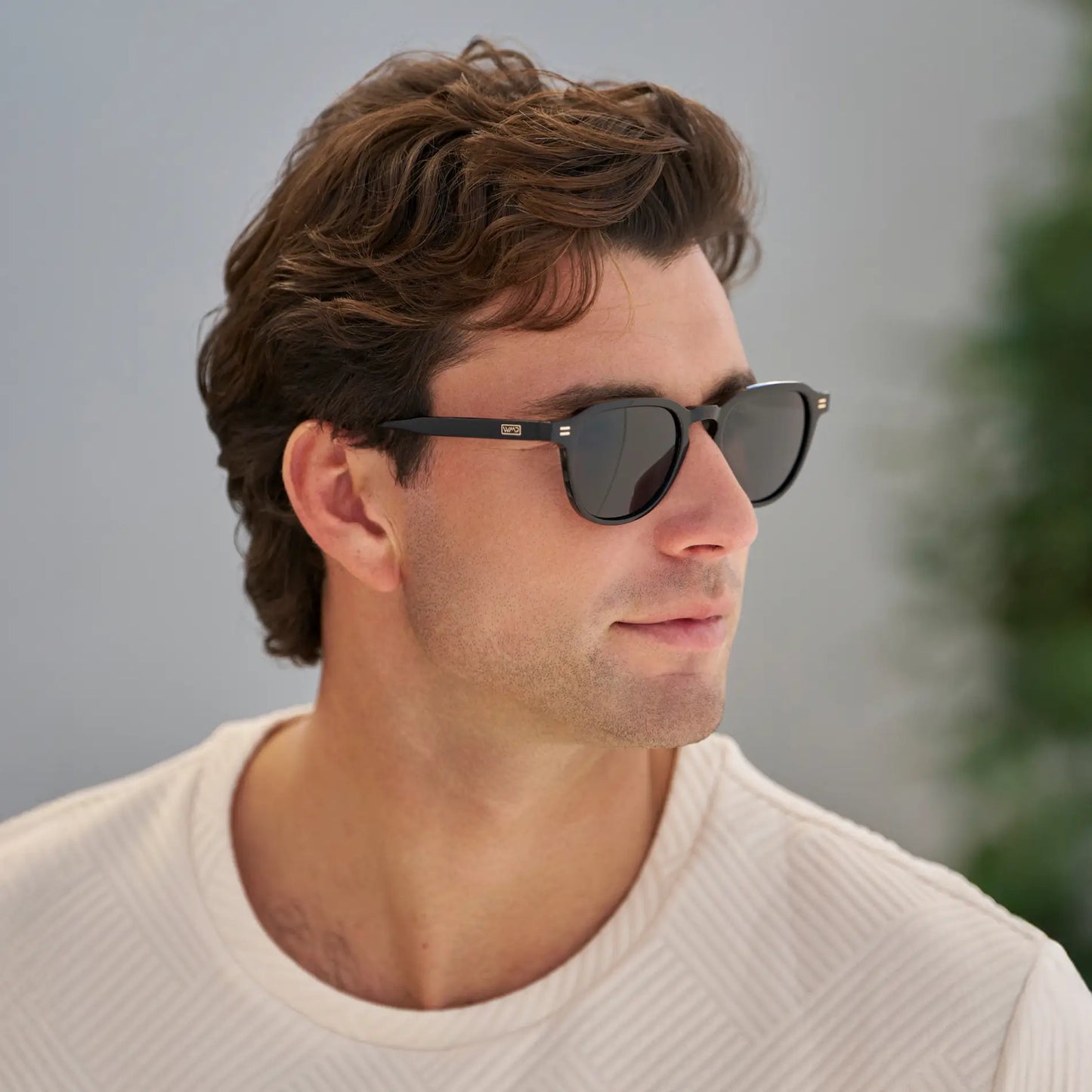 Black / Triple Black Lens || Model wearing Men's Round Polarized Sunglasses with Black Frame and Black Lenses