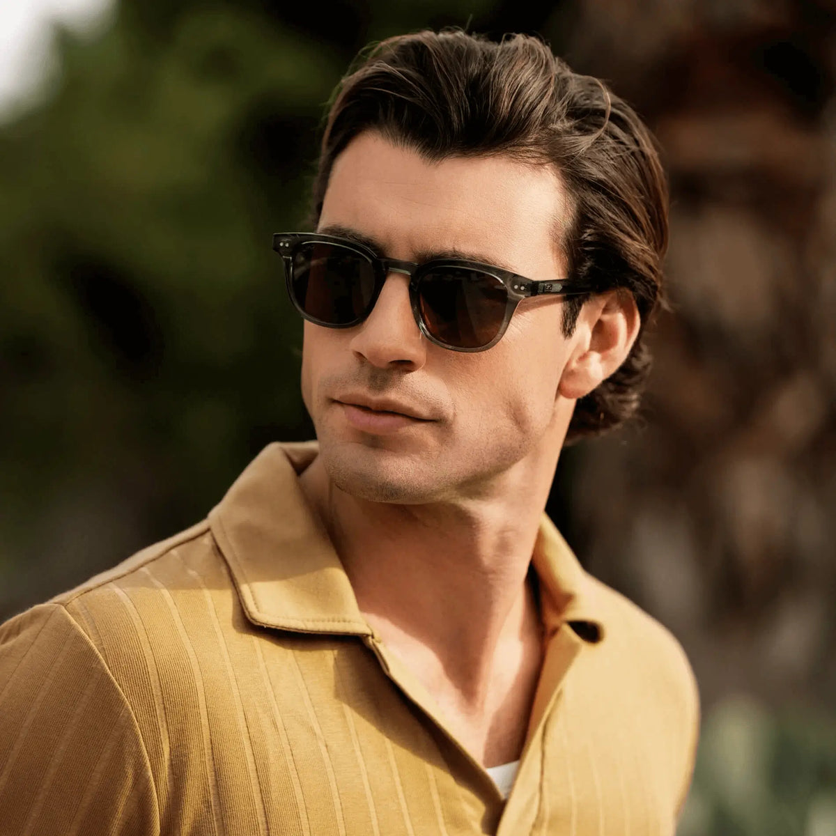 Crystal Stone Blue / Amber || Model wearing Men's Square Prescription Sunglasses with Blue Acetate Frame and Brown Prescription Lenses