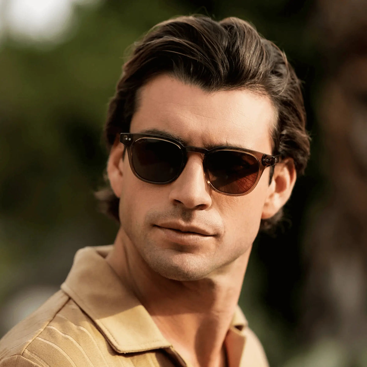 Crystal Verde / Amber || Model wearing Men's Square Prescription Sunglasses with Crystal Verde Acetate Frame and Brown Prescription Lenses