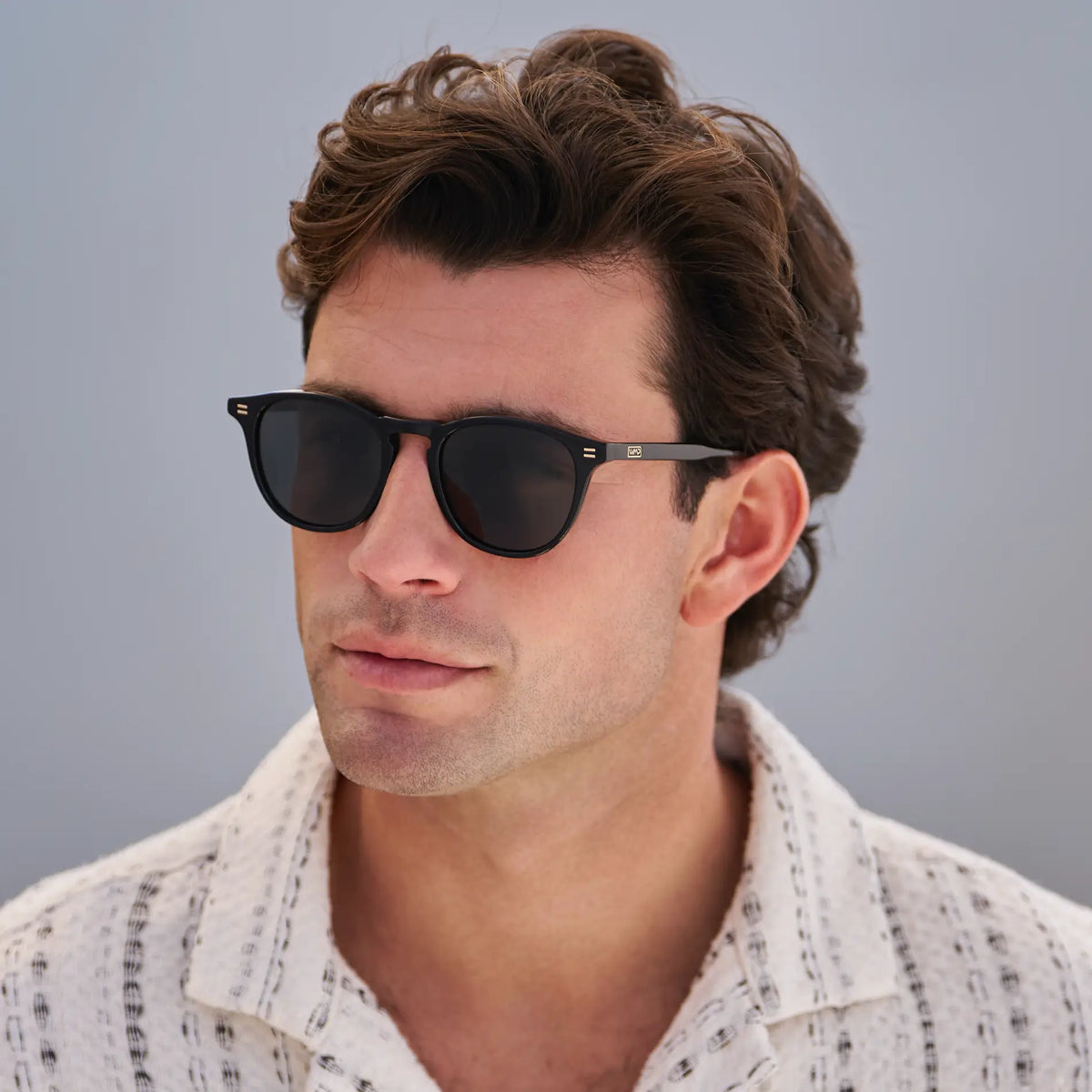 Black / Grey || Men's Round Prescription Sunglasses with Black Frame and Grey Lenses worn by a man in natural light