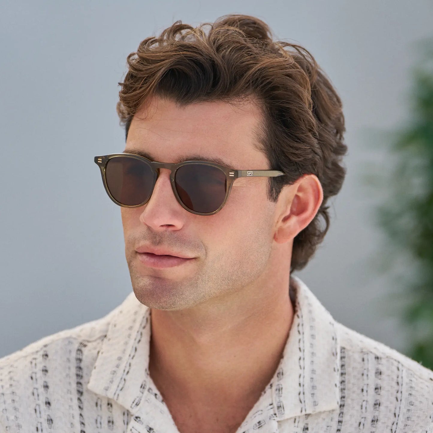 Khaki Green / Dark Brown Lens || Model wearing Men's Round Polarized Sunglasses with Green Frame and Dark Brown Lenses