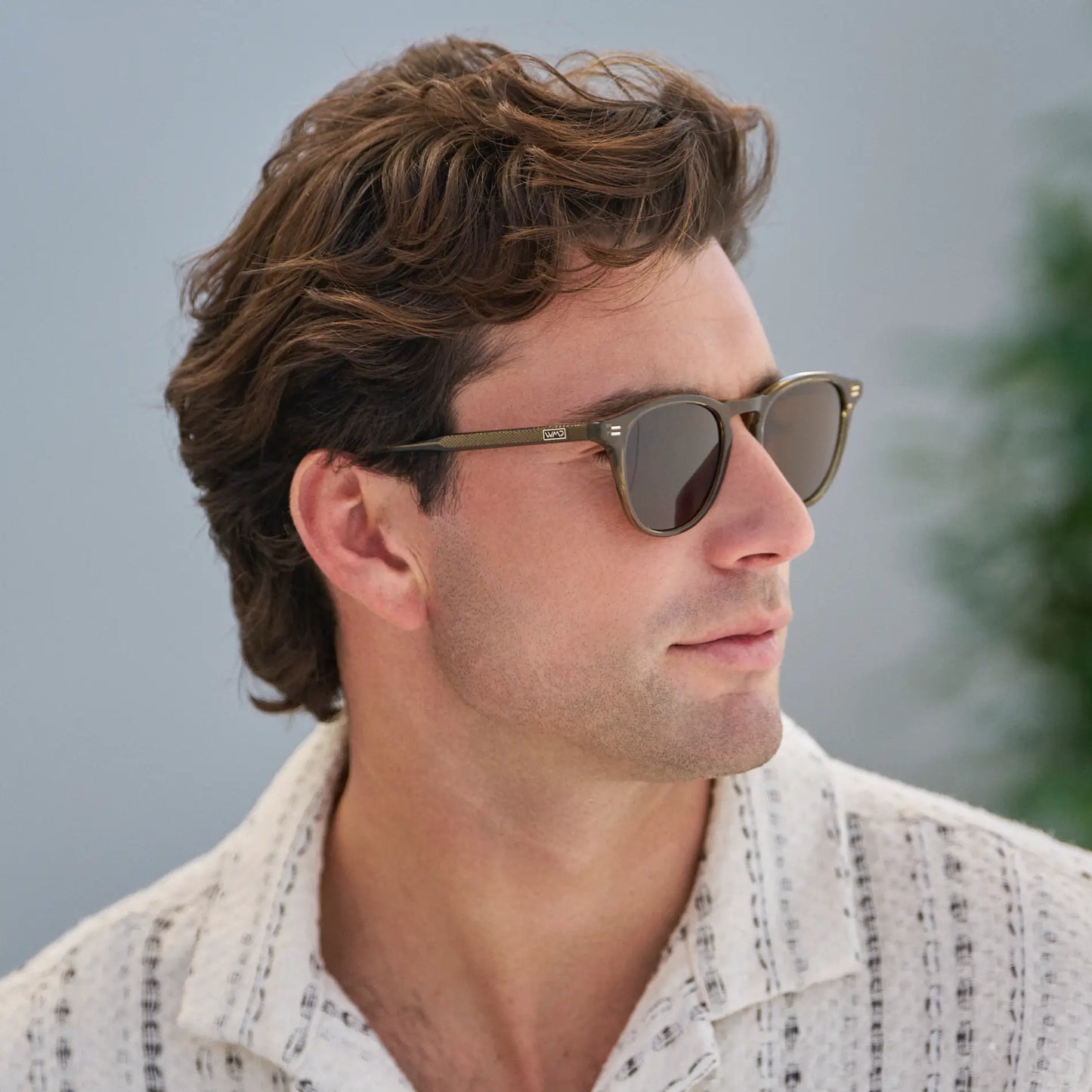 Khaki Green / Dark Brown Lens || Model wearing Men's Round Polarized Sunglasses with Green Frame and Dark Brown Lenses