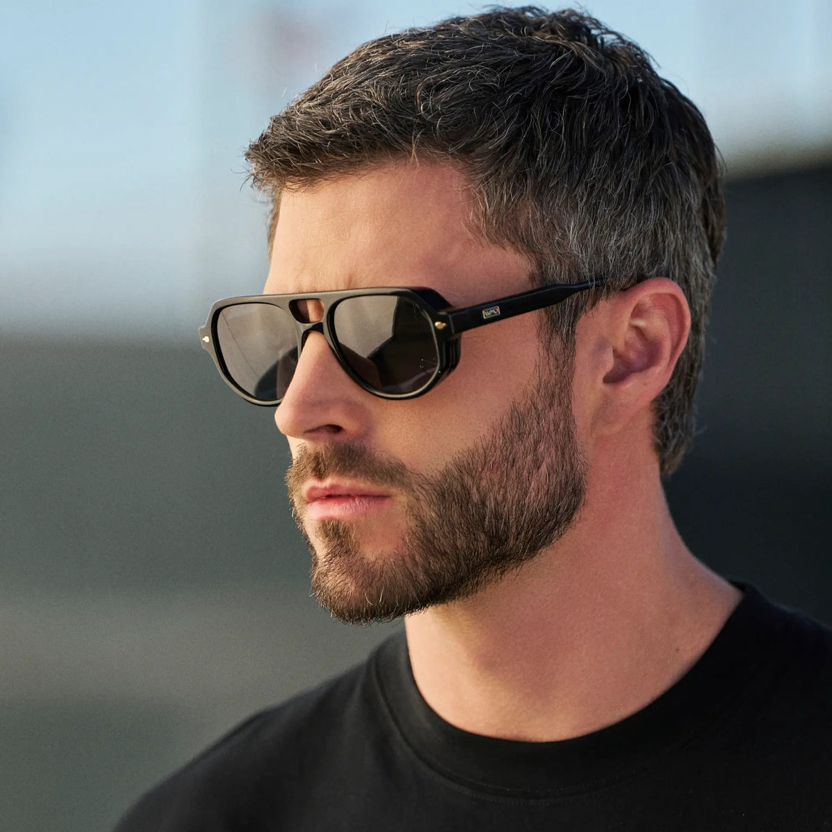 Black / Grey || Man wearing Geometric Aviator Prescription Sunglasses with Black Frame and Grey Lens outdoors