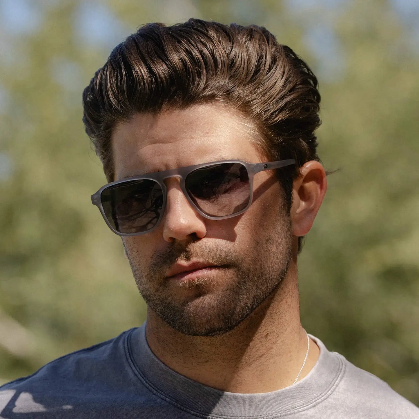 Moonrock Grey / Grey Lens || Single Bridge Aviator prescription sunglasses with moonrock grey acetate frame and straight keyhole bridge worn by man outdoors