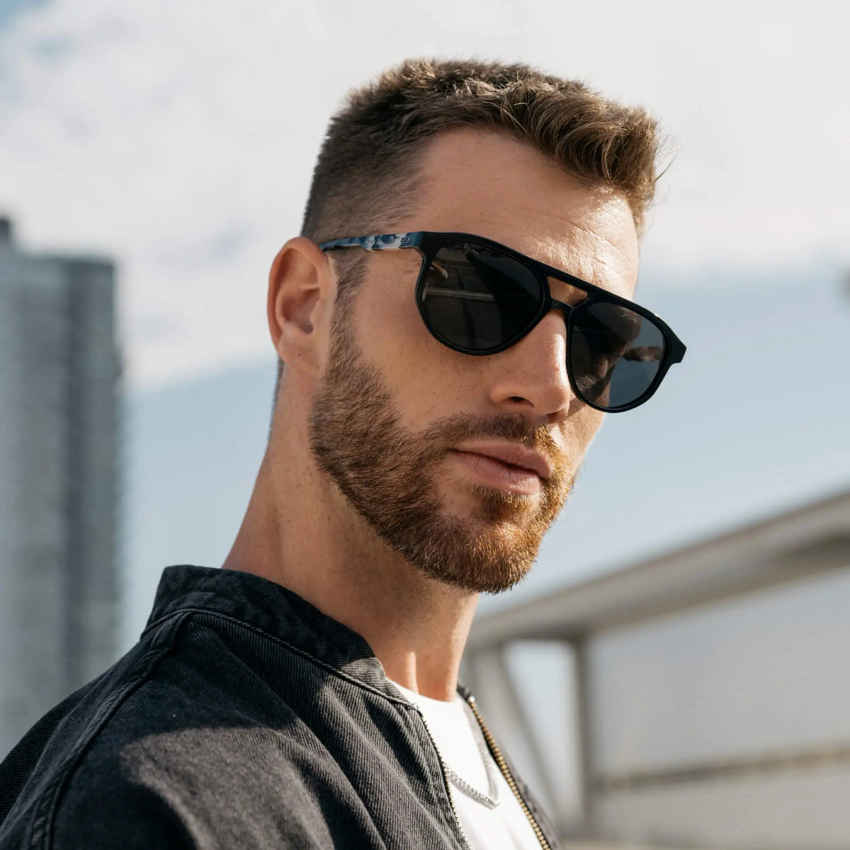 Black Beige Tortoise / Grey || Model wearing Men's Modern Aviator Prescription Sunglasses with Black Acetate Frame and Grey Prescription Lens