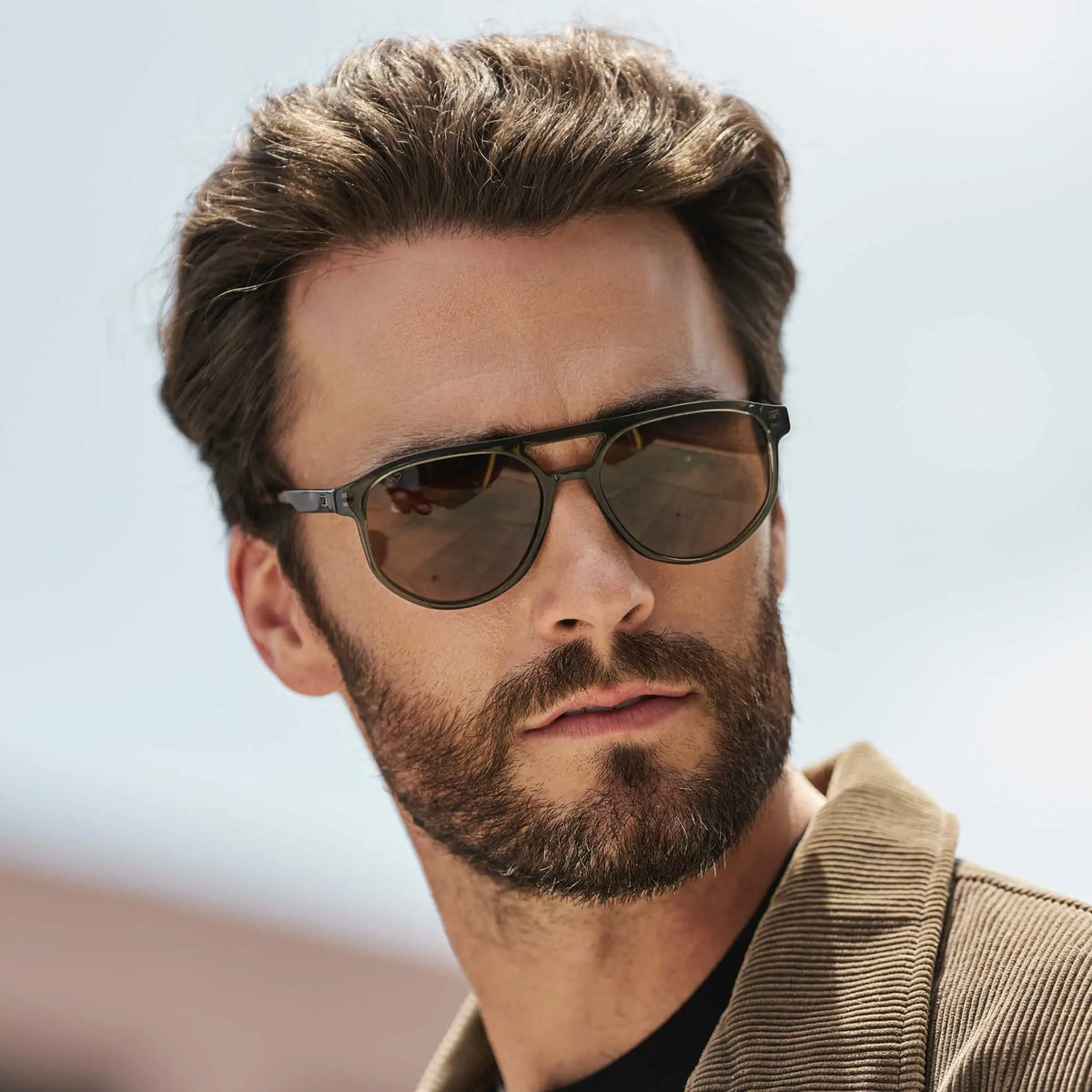 Tortoise Sage / Amber || Model wearing Men's Modern Aviator Prescription Sunglasses with Green Acetate Frame and Brown Prescription Lens