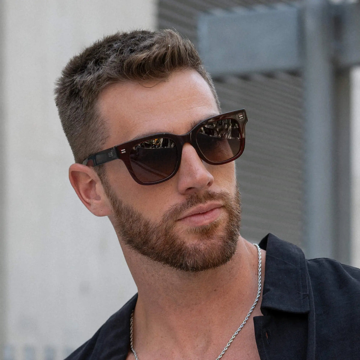 Red Garnet / Amber || Model wearing Men's Square Frame Prescription Sunglasses with Red Frame and Brown Lenses