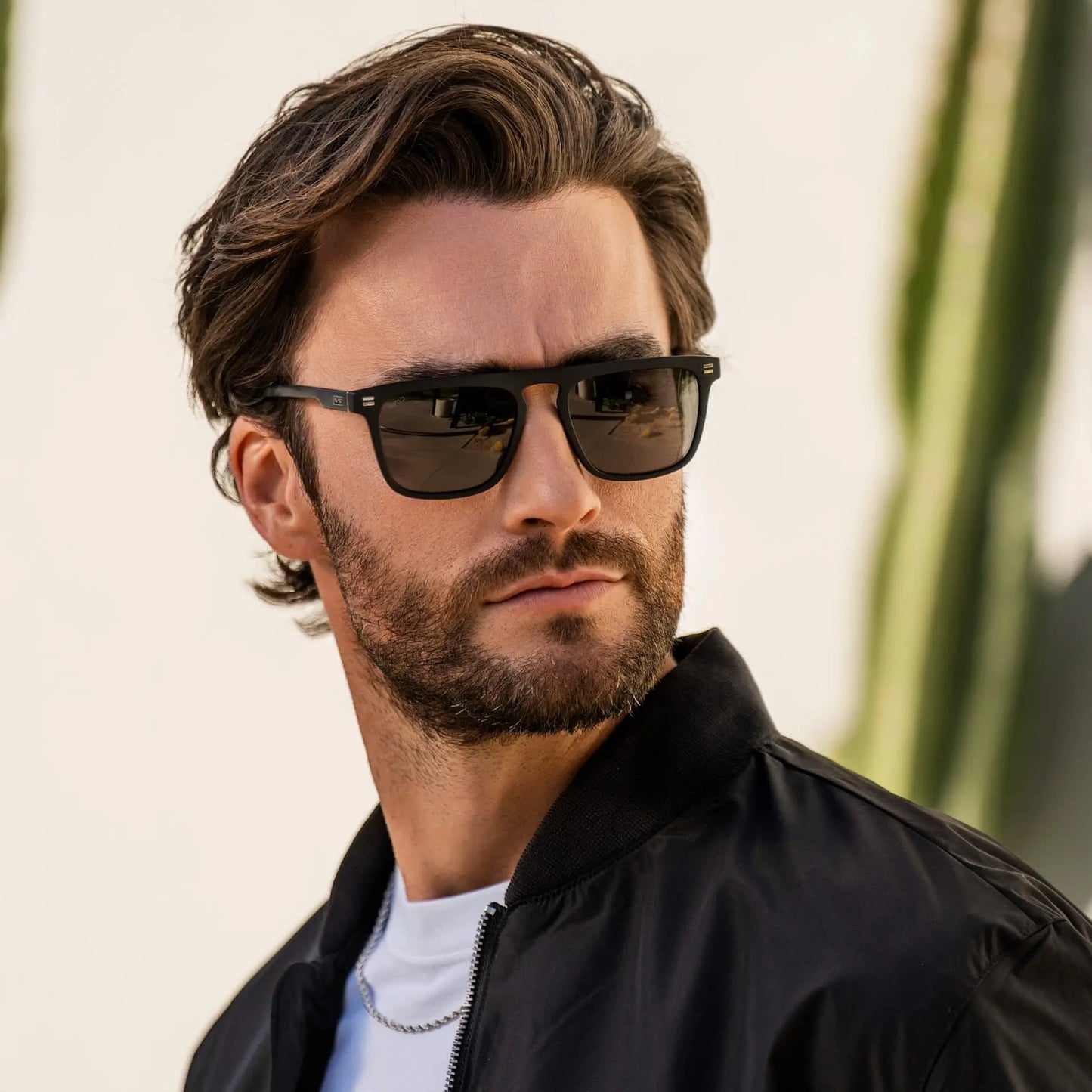 Matte Black / Grey || Model wearing Men's Sleek and Modern Prescription Sunglasses with Matte Black Frame and Grey Lenses