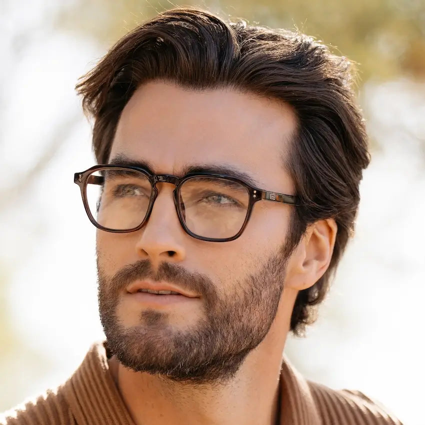 Brown Tortoise || Square prescription glasses with brown tortoise frame and subtle keyhole bridge worn by man outdoors in natural light