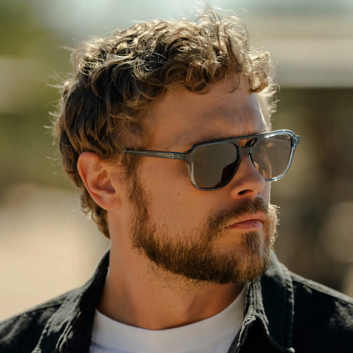 Crystal Stone Blue / Amber || Model wearing Men's Double Bridge Aviator Prescription Sunglasses with Crystal Blue Acetate Frame and Amber Prescription Lens