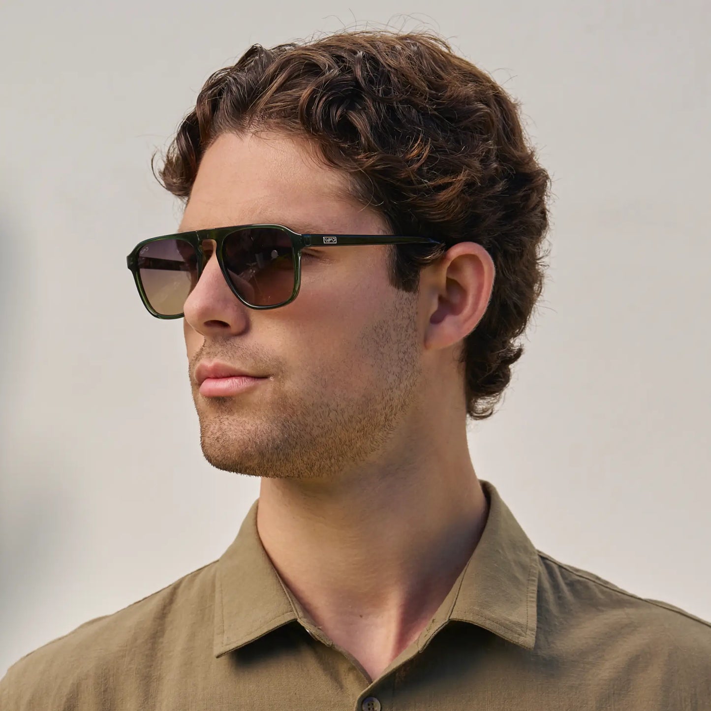 Jade Green / Grey Brown Gradient Lens || Model wearing Unisex Jade Green Single Bridge Aviator Sunglasses with Grey Brown Gradient Polarized Lenses