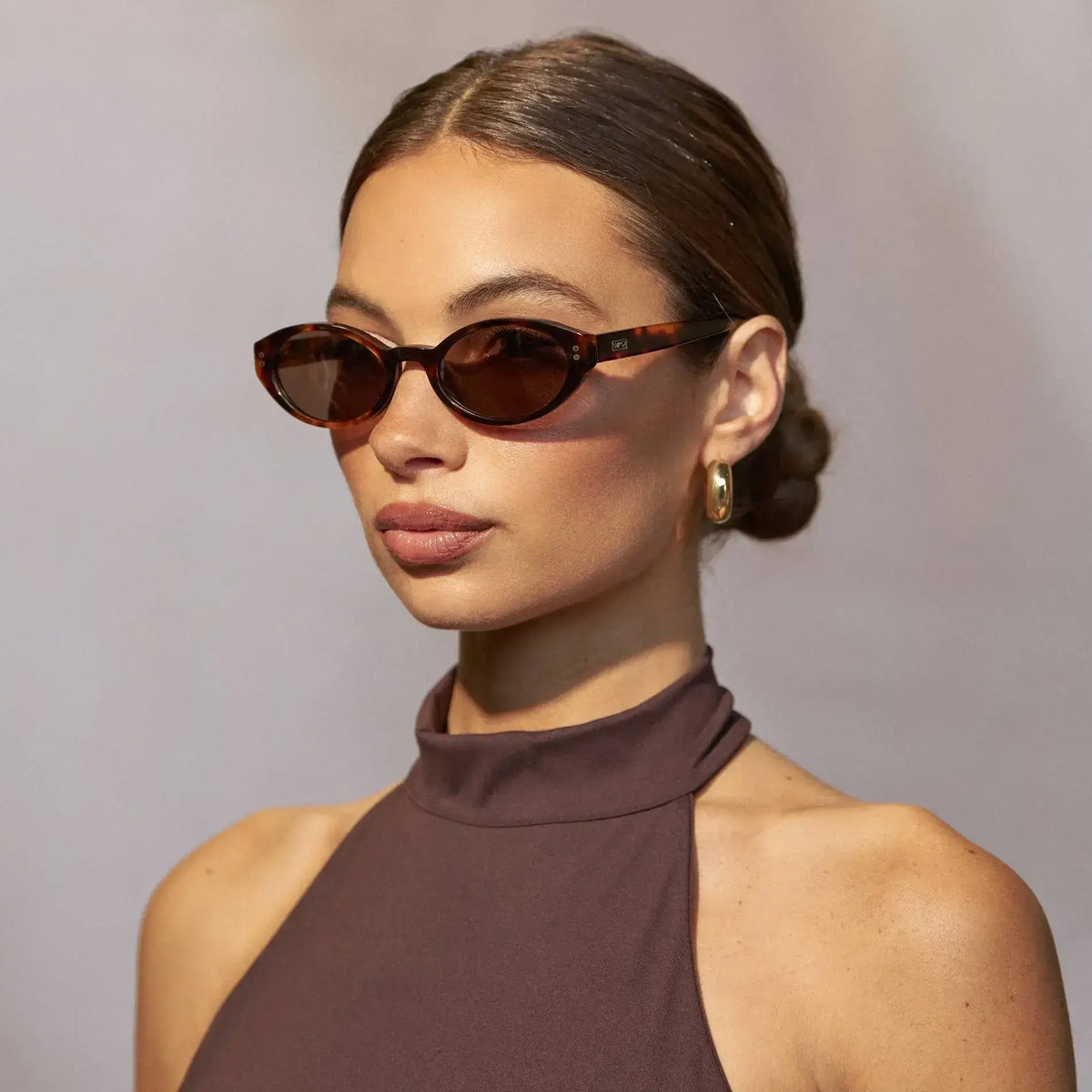 Brown Tortoise / Brown Lens || Woman wearing Elongated Oval Sunglasses with Brown Tortoise Frame and Brown Lens