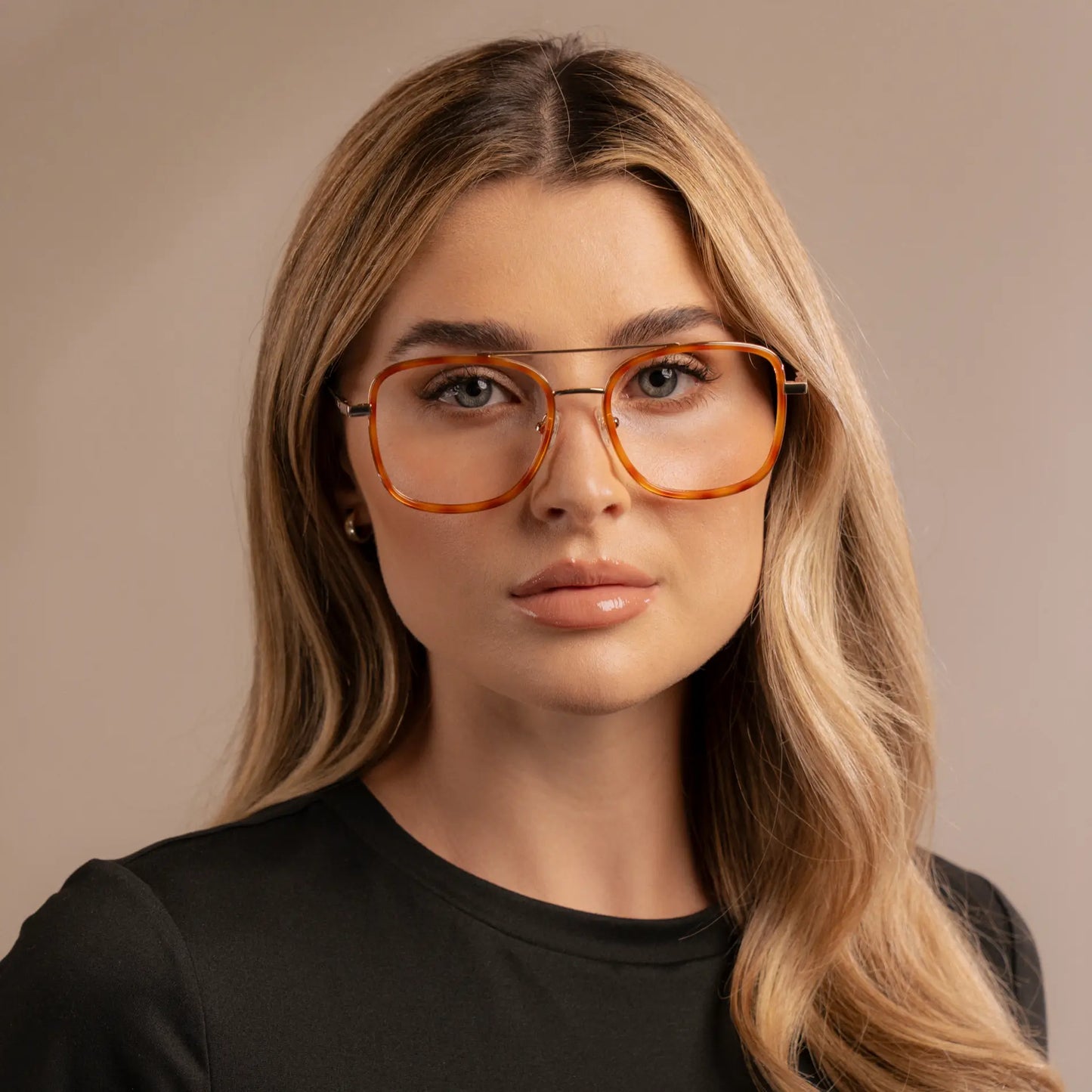 Sunset Tortoise || Woman wearing Oversized Square Aviator Prescription Eyeglasses with Orange Tortoise Acetate and Stainless Steel Frame and Clear Lenses