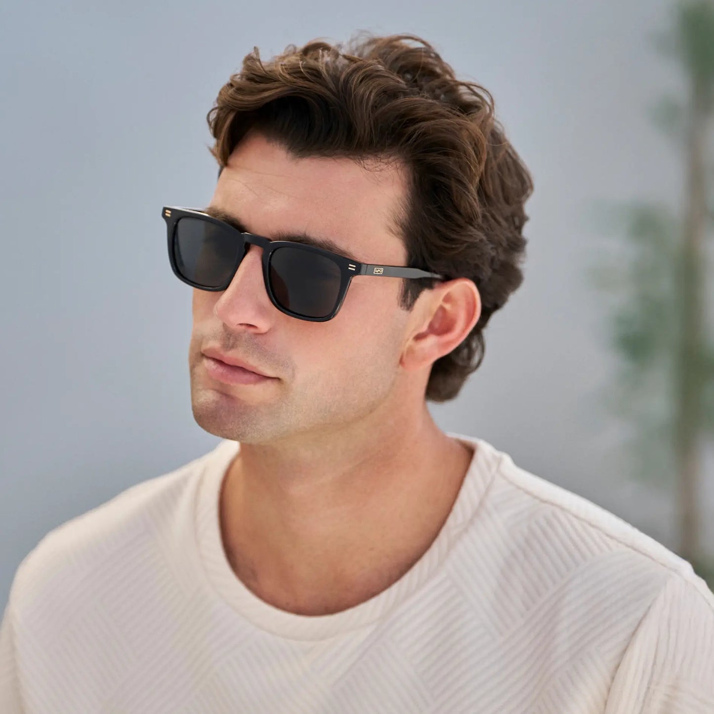 Black / Grey || Men's Rectangular Prescription Sunglasses with Black Frame and Grey Lenses worn by a man outdoors