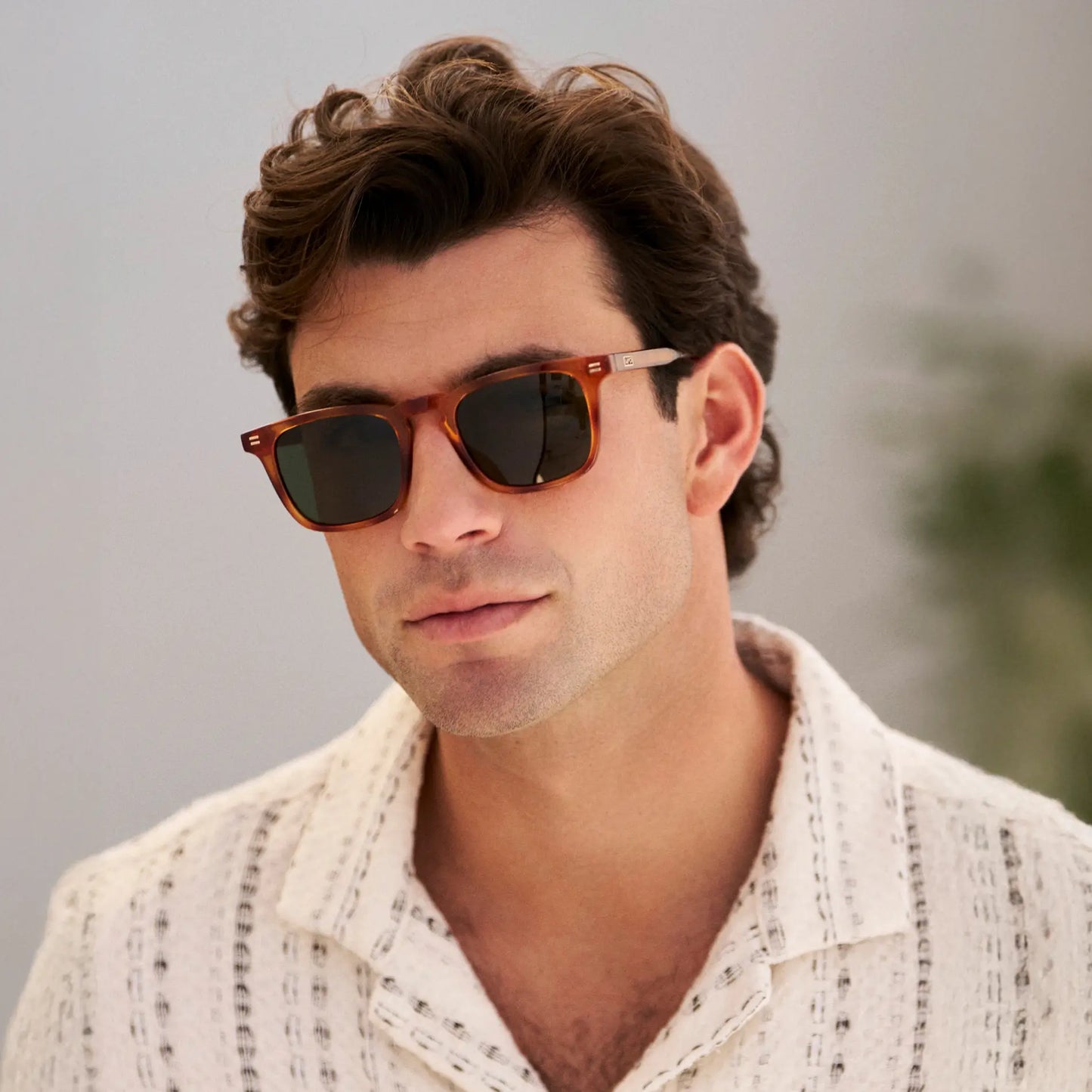 Honey Tortoise / G15 || Model wearing Men's Rectangular Prescription Sunglasses with Honey Tortoise Frame and Green Lenses on a white background