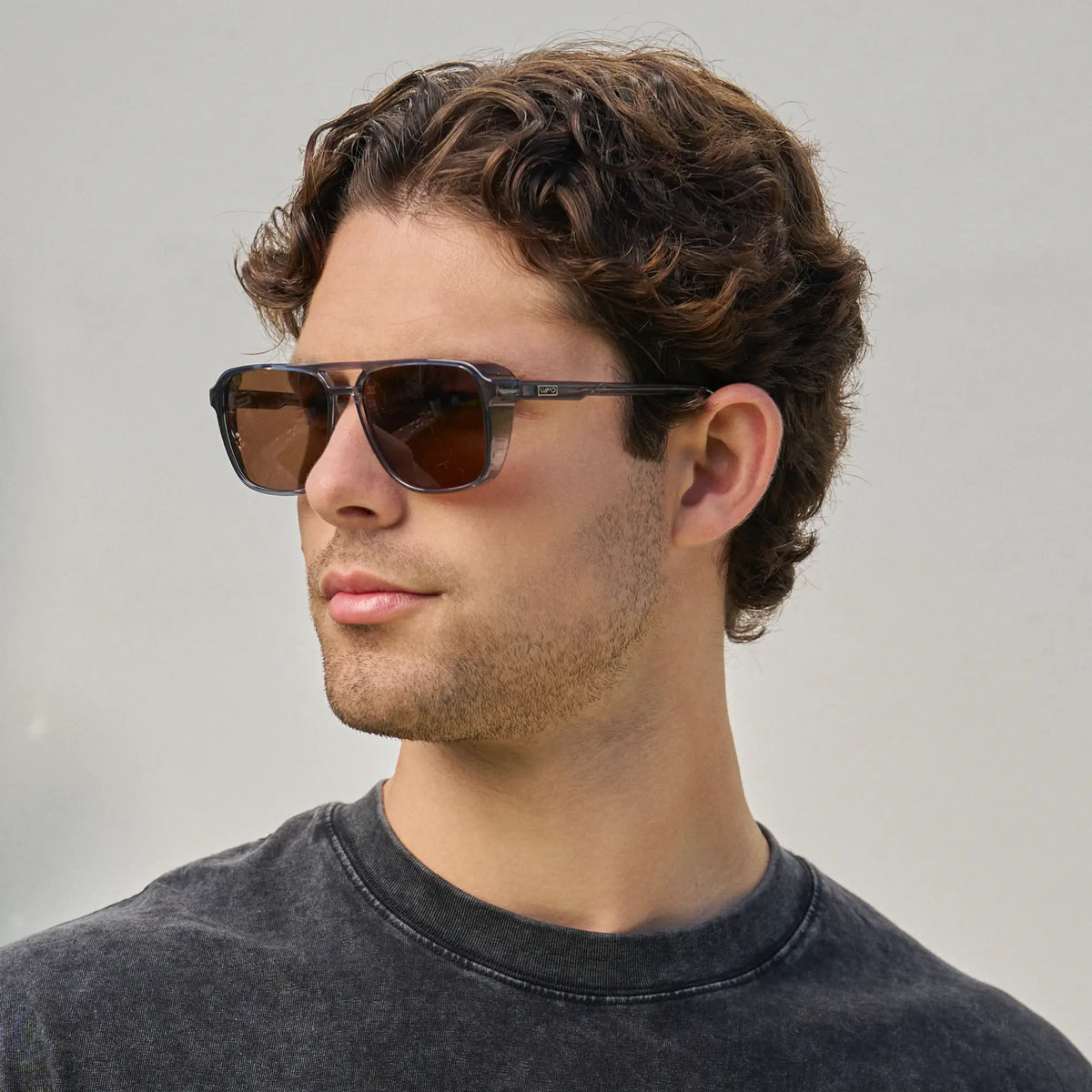 Stone Blue / Amber || Man wearing Stone Blue Men's Square Aviator Prescription Sunglasses with Brown Lenses