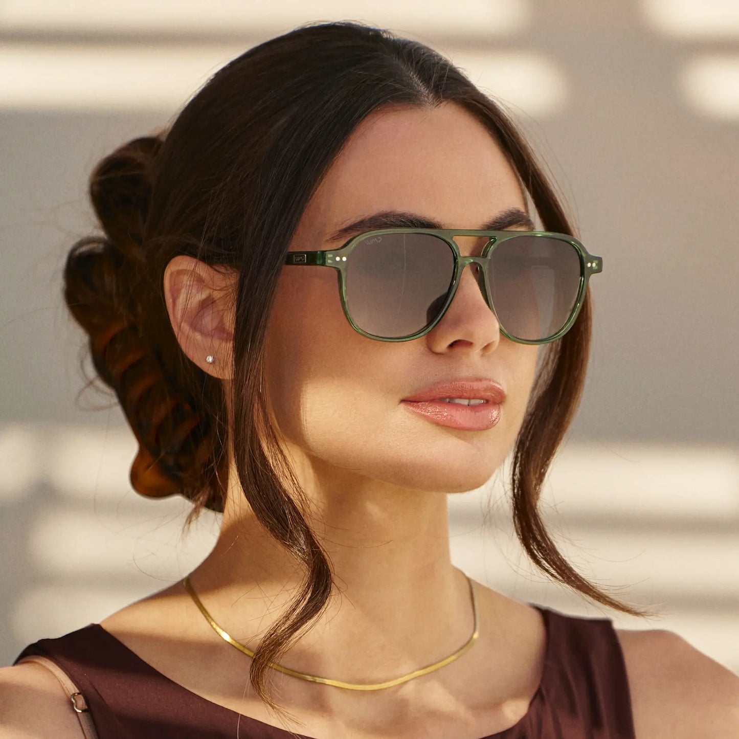 Emerald Green / Grey || Square prescription sunglasses with emerald green acetate frame, keyhole bridge, and grey lenses worn by woman outdoors