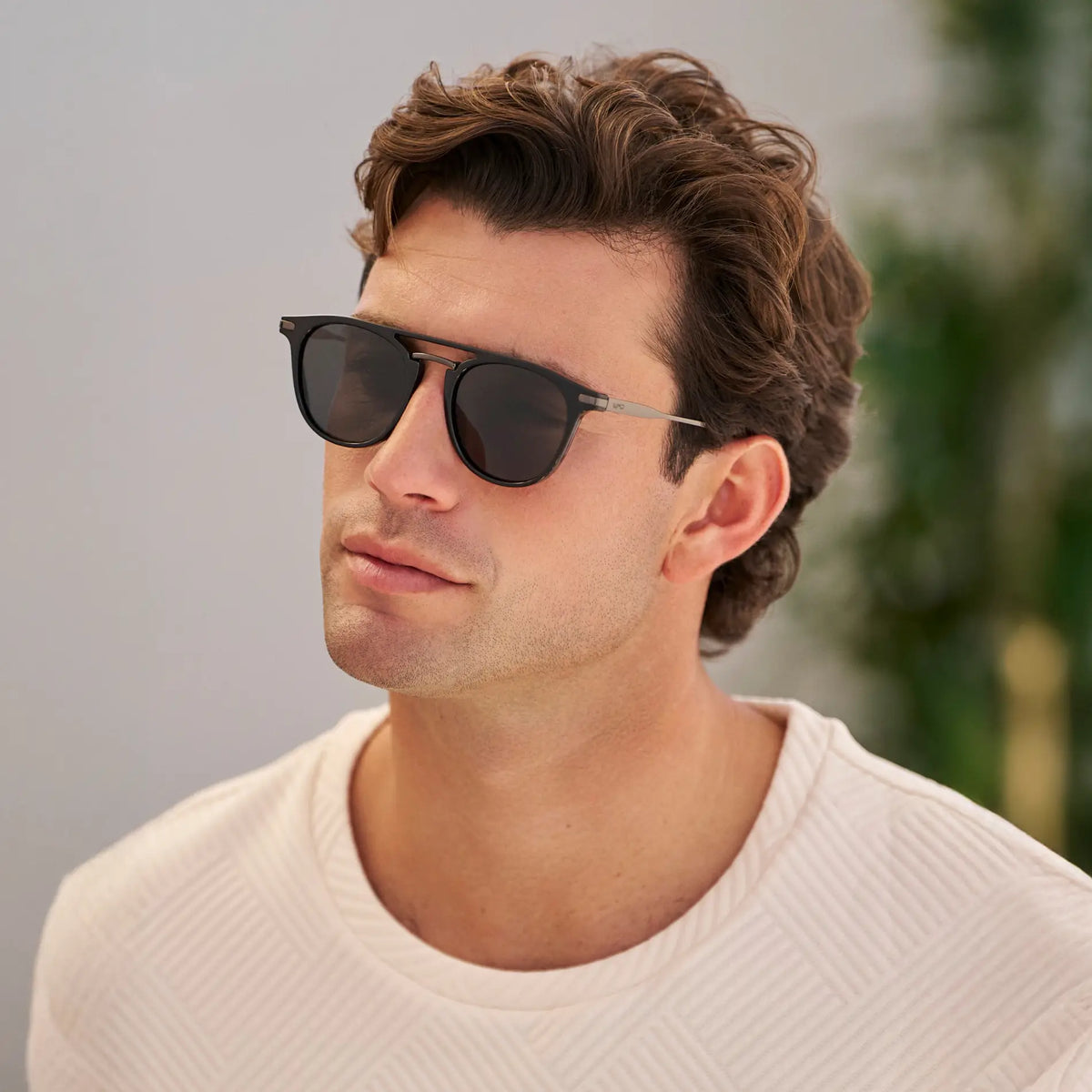 Black / Grey || Men's Round Prescription Sunglasses with Black Frame and Grey Lenses worn by a man outdoors