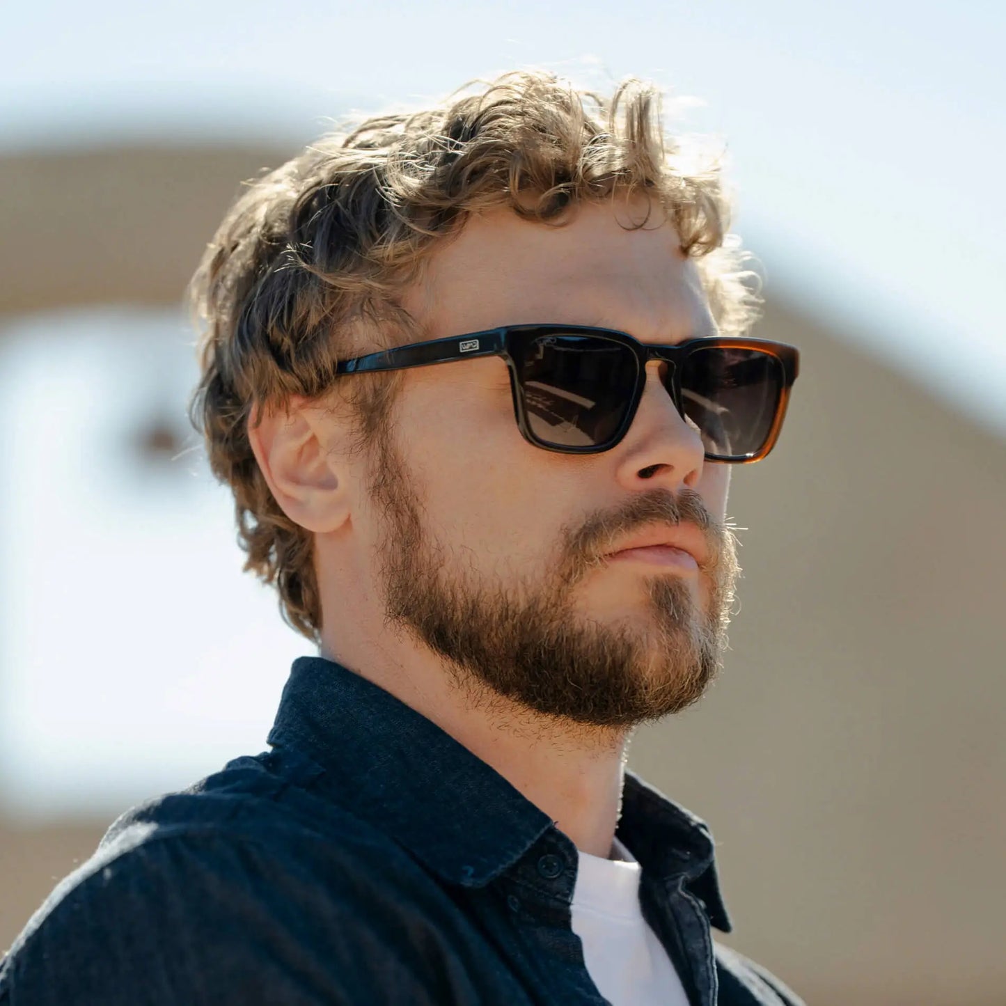 Burnt Cedar Brown / Amber || Model wearing Men's Sleek Square Prescription Sunglasses with Burnt Cedar Brown Acetate Frame and Amber Prescription Lens