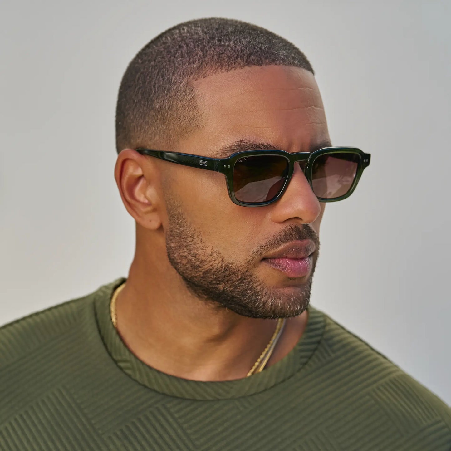 Jade Green / Brown Gold Gradient Lens || Model wearing Men's Rectangular Polarized Sunglasses with Jade Green Acetate Frame and Brown Gold Gradient Lens