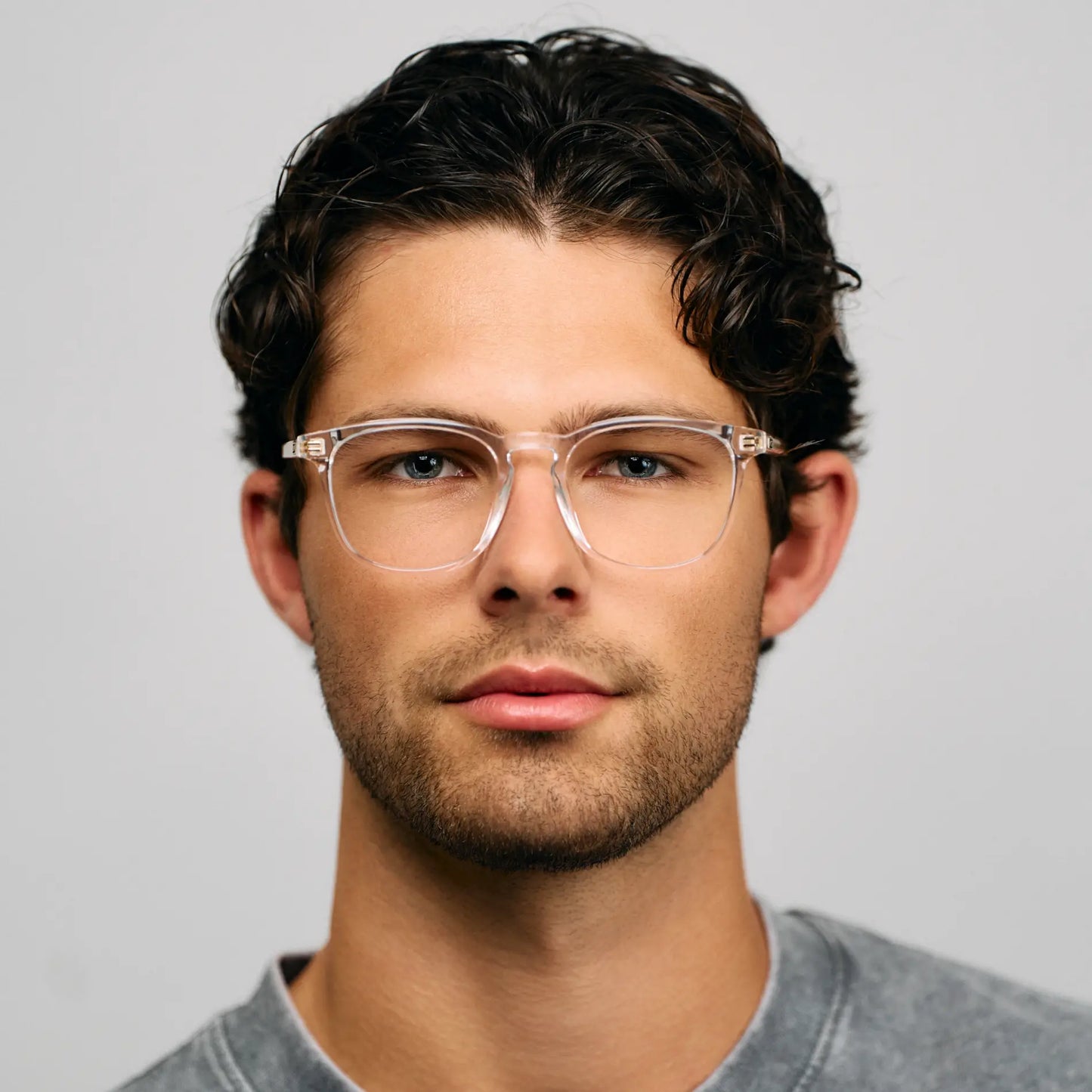 Clear || Lightweight square prescription glasses with clear acetate frame and keyhole bridge worn by man