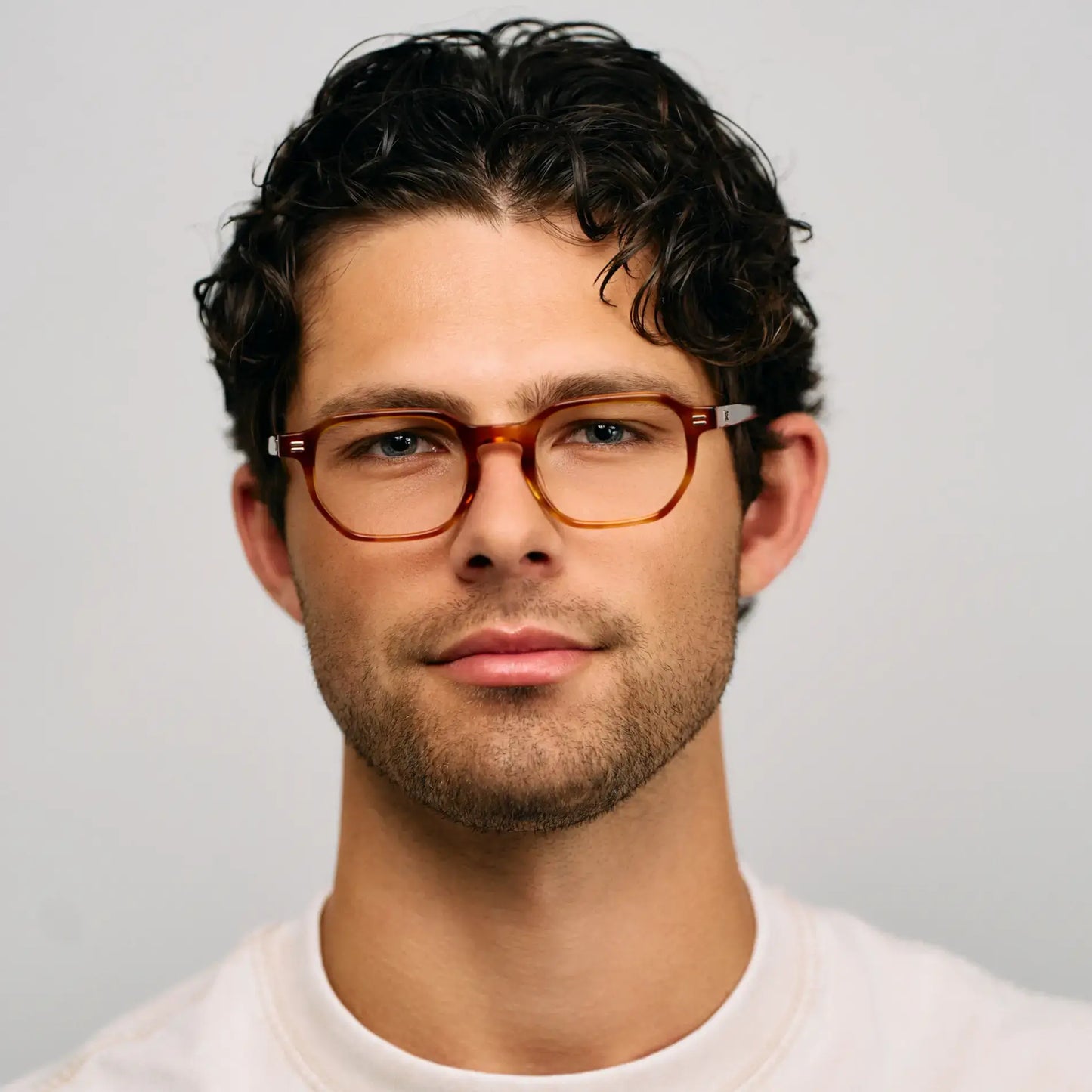 Honey Tortoise || Model wearing Unisex Geometric Rectangular Prescription Eyeglasses with Honey Tortoise Acetate Frame and Clear Lens