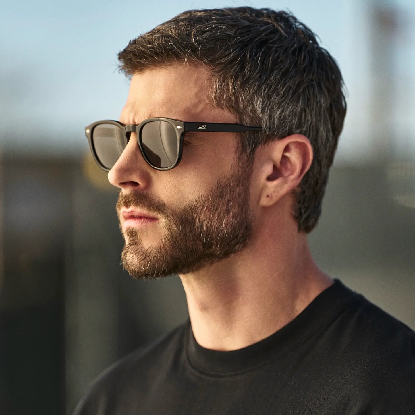 Black / Grey || Man wearing Round Prescription Sunglasses with Black Frame and Grey Oval Lens outdoors