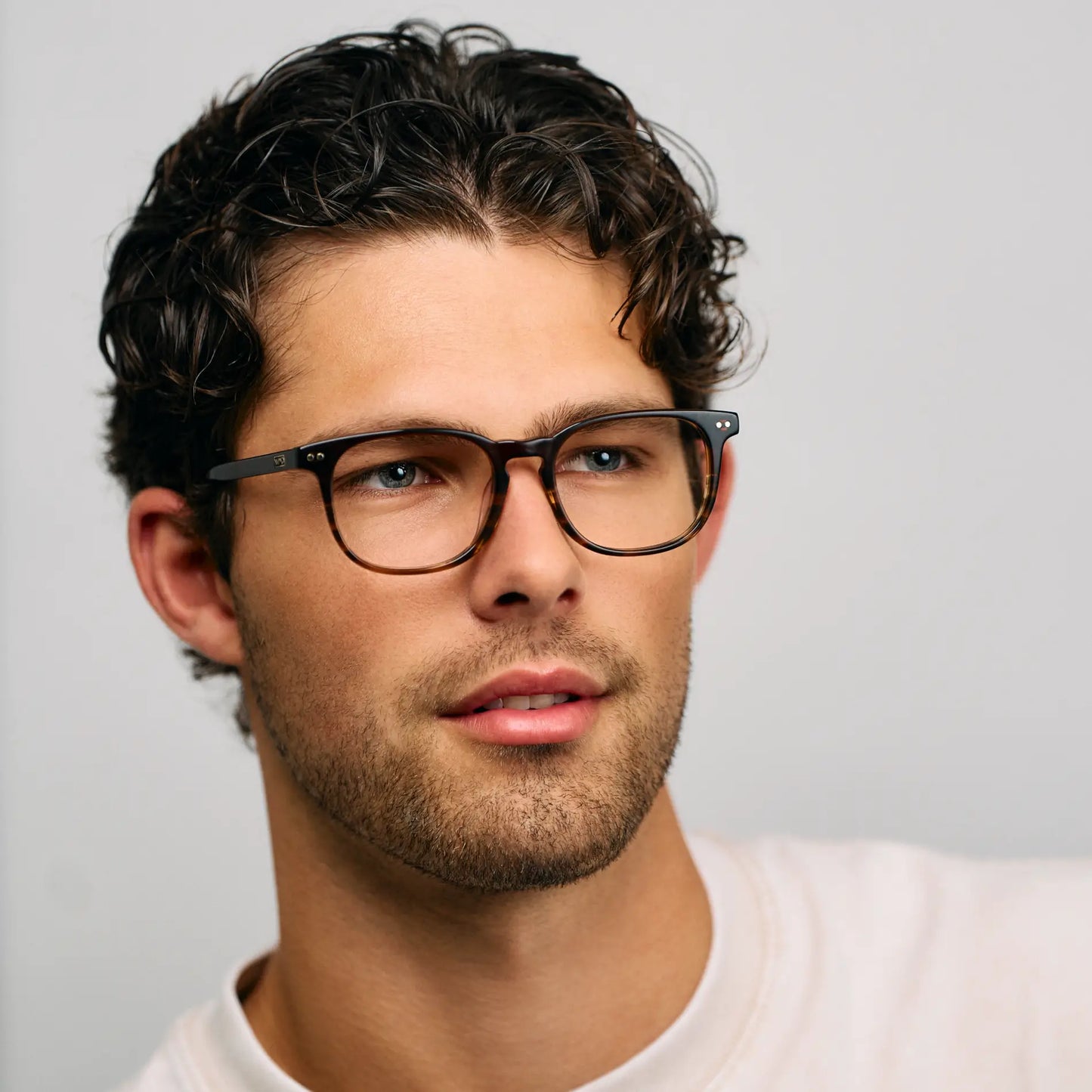 Rye Brown || Male model wearing rectangular blue light blocking glasses with Rye Brown acetate frame