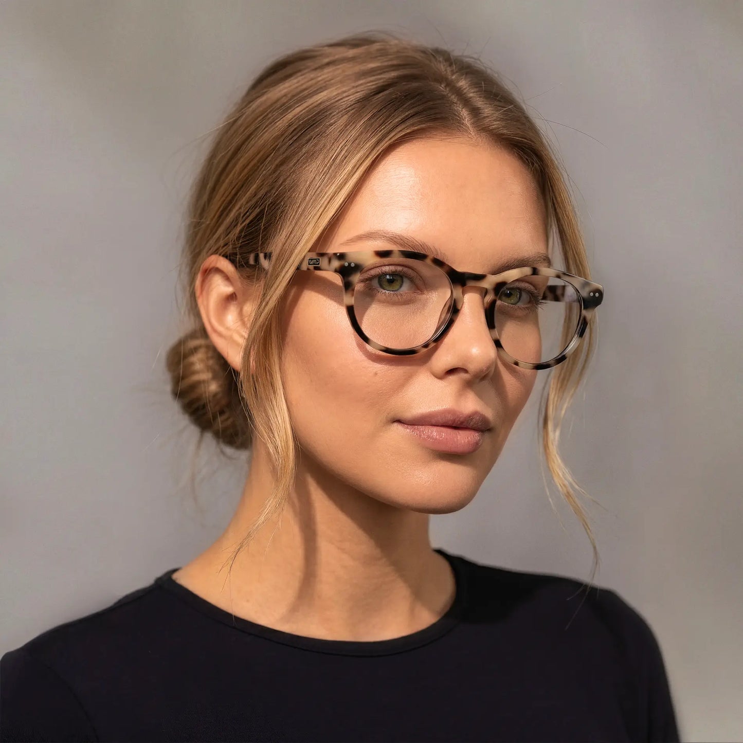 Beige Tortoise || Round acetate prescription eyeglasses with subtle beige tortoise pattern frame worn by woman indoors
