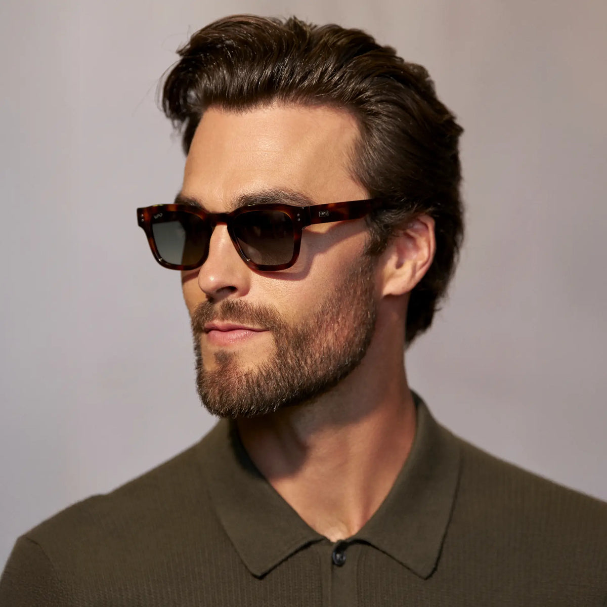 Havana Tortoise / G15 || Model wearing Men's Geometric Rectangular Prescription Sunglasses with Havana Tortoise Acetate Frame and Green Prescription Lens