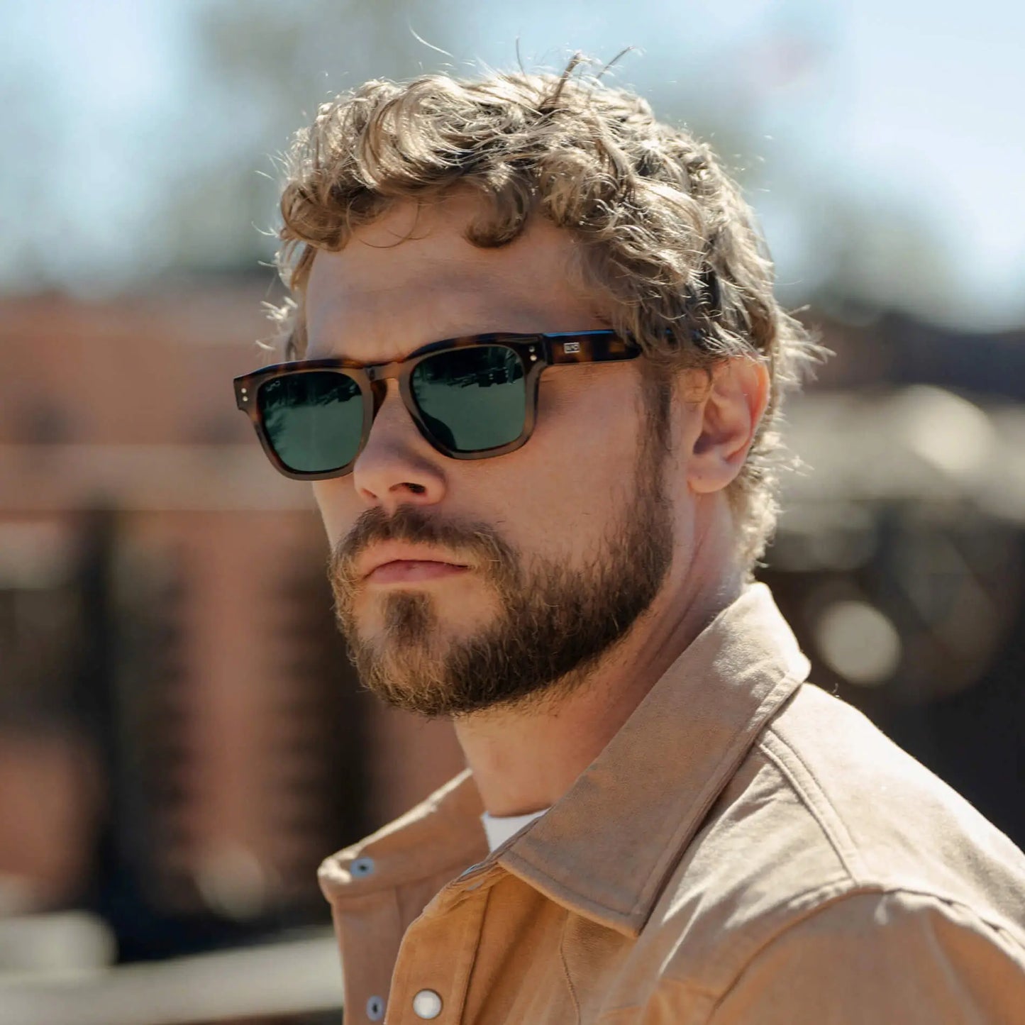 Havana Tortoise / G15 || Model wearing Men's Geometric Rectangular Prescription Sunglasses with Havana Tortoise Acetate Frame and Green Prescription Lens