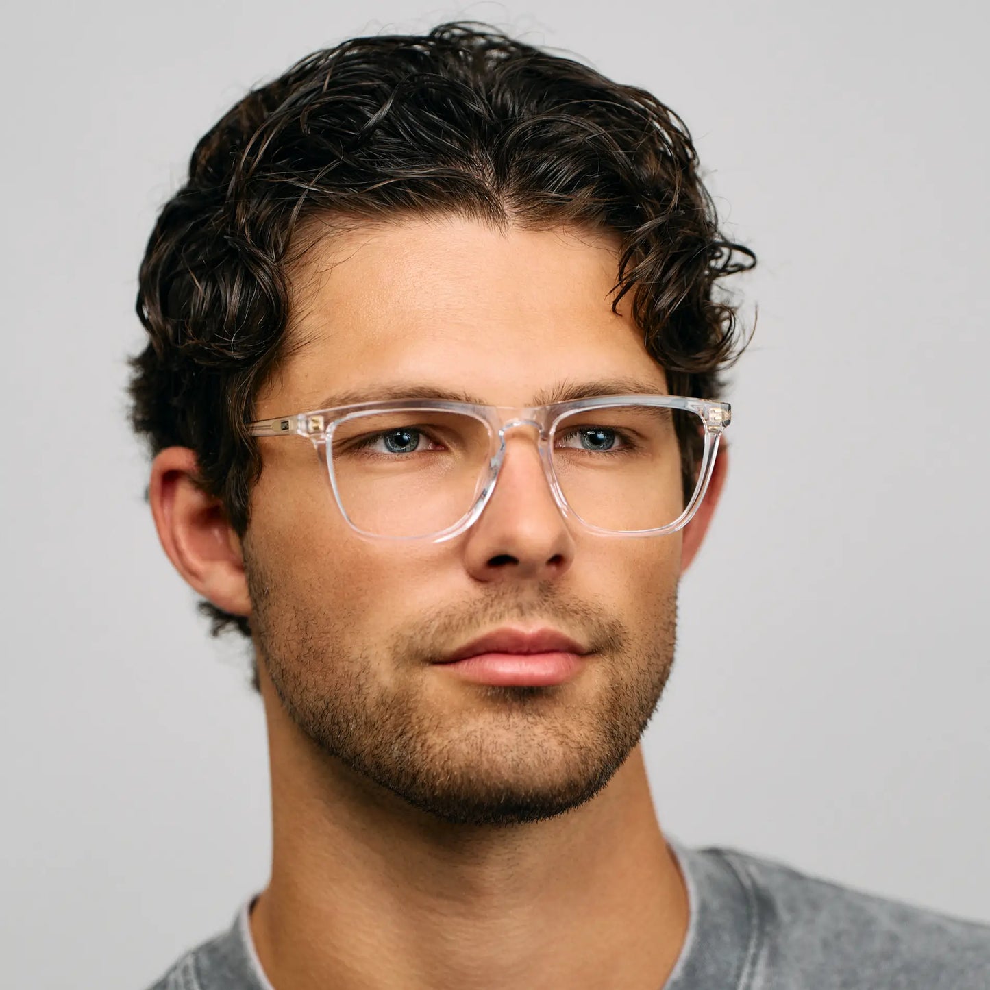 Clear || Transparent clear square prescription glasses with keyhole bridge and clear lenses worn by man indoors