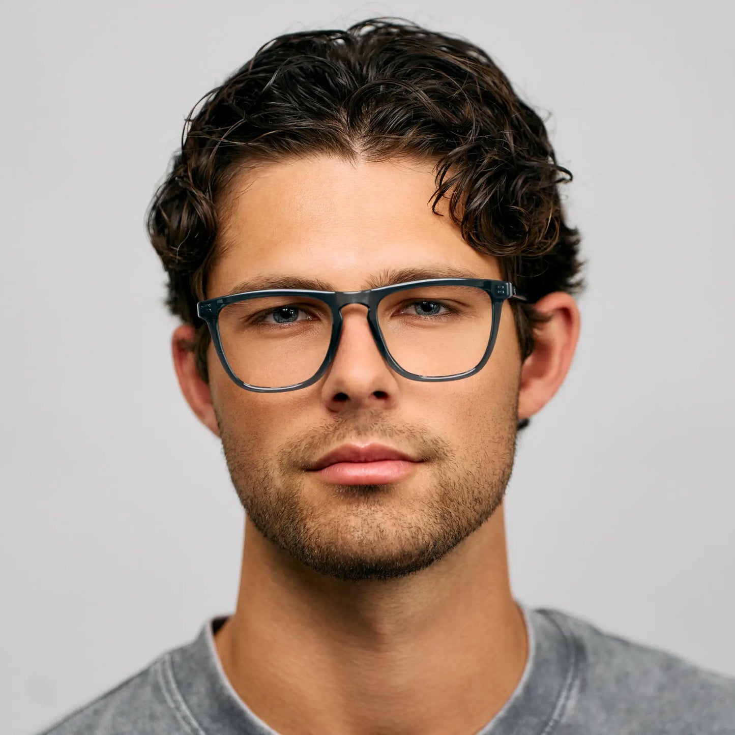 Crystal Stone Blue || Square prescription glasses with blue acetate frame and a straight bridge worn by man with short curly hair