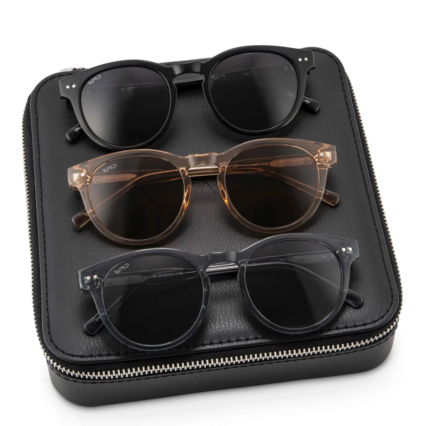 Black Case || Three pairs of round frame sunglasses in black, translucent brown, and translucent gray, displayed on a black zippered case