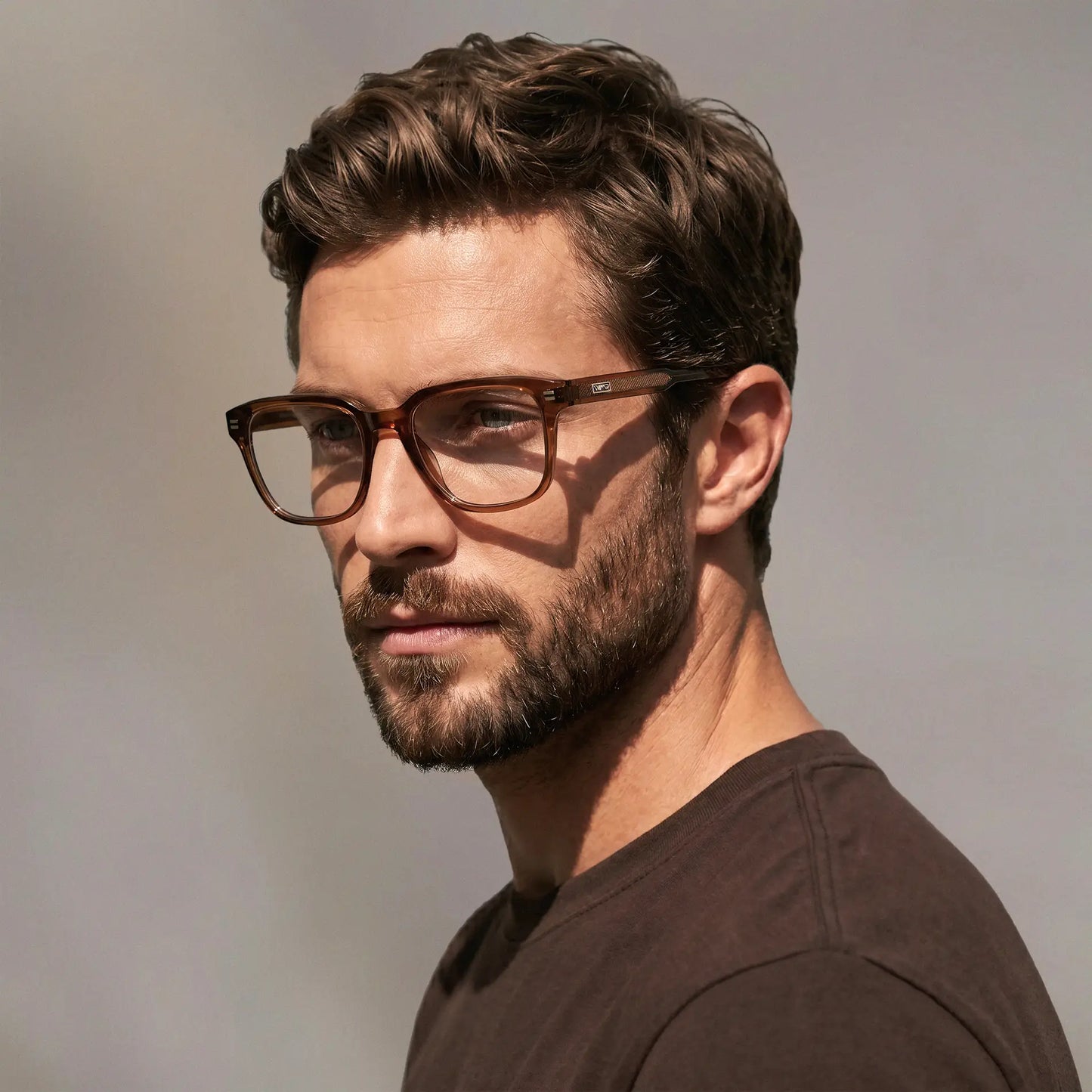 Canyon Brown || Men's Geometric Rectangular Eyeglasses with Canyon Brown Acetate Frame and Clear Prescription Lens on a male model wearing a brown shirt.