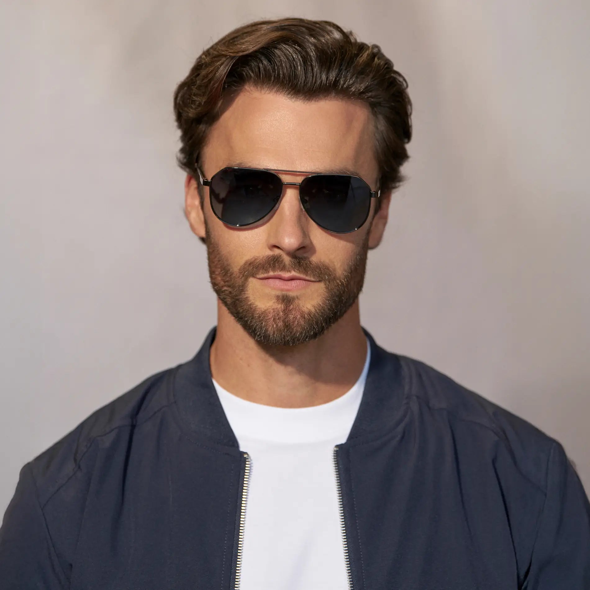 Gunmetal / Deep Blue Gradient Lens || Model wearing Men's Stainless Steel Aviator Sunglasses with Gunmetal Frame and Deep Blue Gradient Lens 