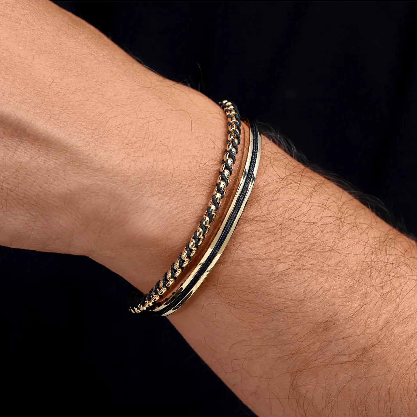 The Obsidian Kit || Men's Gift Kit including Two Pairs of Black Acetate Frame Polarized Black Lens Sunglasses, a stainless steel cuff bracelet, and a stainless steel and polyester rope braided bracelet in gold and black