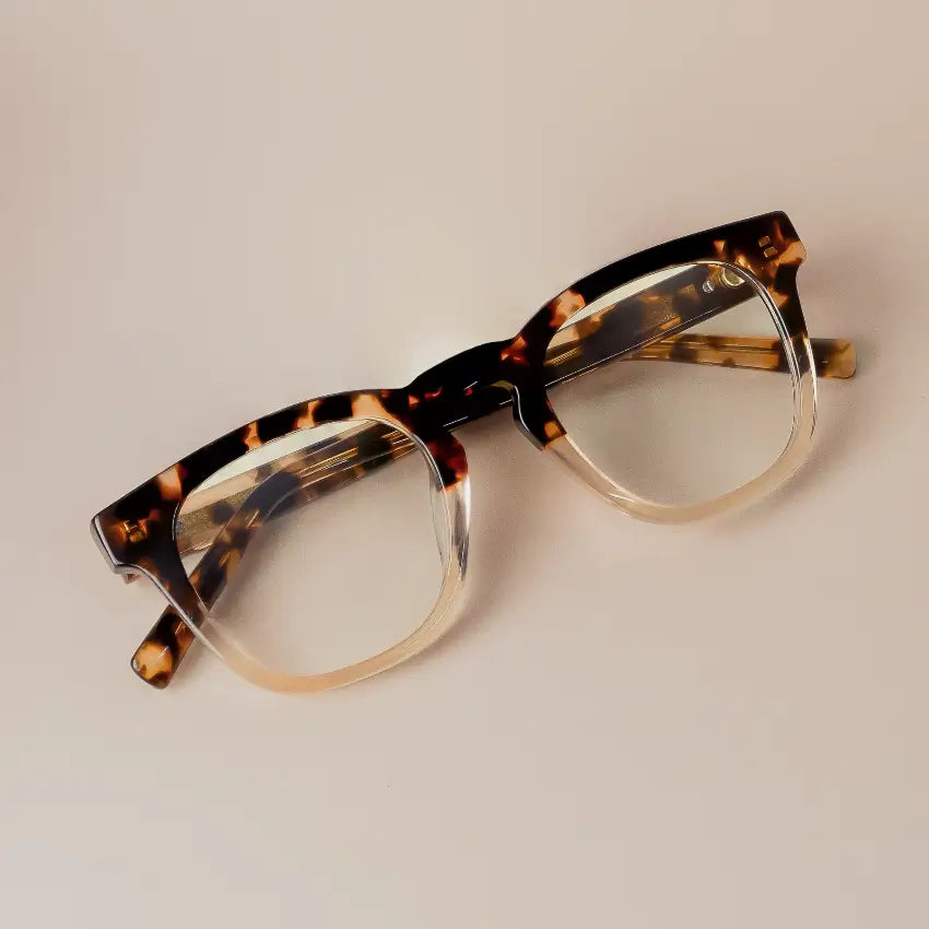 Crystal Brown Tortoise || Aspen square frame glasses with gradient tortoise pattern and clear blue light lenses on beige background
