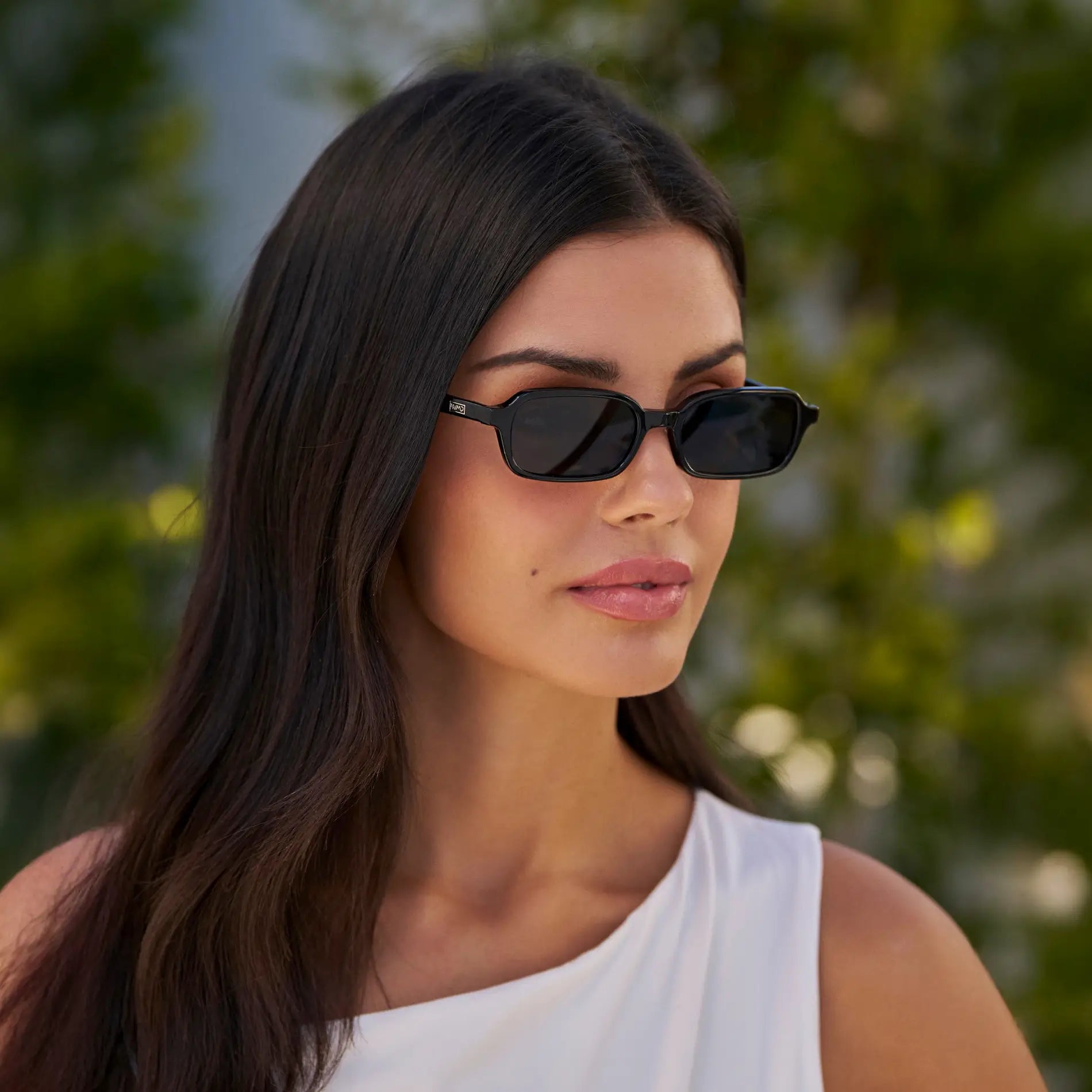 Black / Triple Black Lens || Model wearing Women's Rectangular Sunglasses with Black Frame and Anti-Reflective Black Lenses