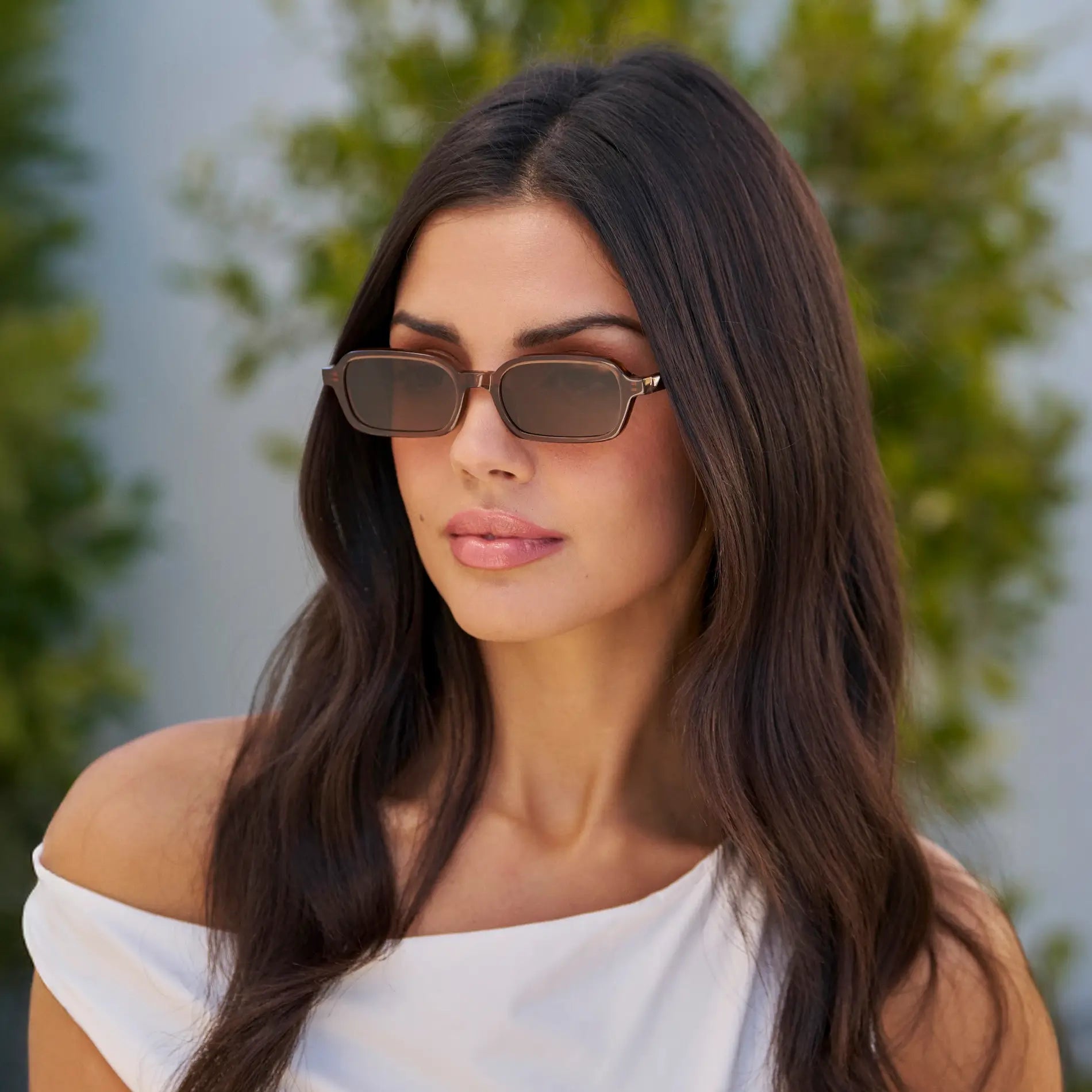 Cocoa Brown / Brown Lens || Model wearing Women's Rectangular Sunglasses with Cocoa Brown Frame and Anti-Reflective Brown Lenses
