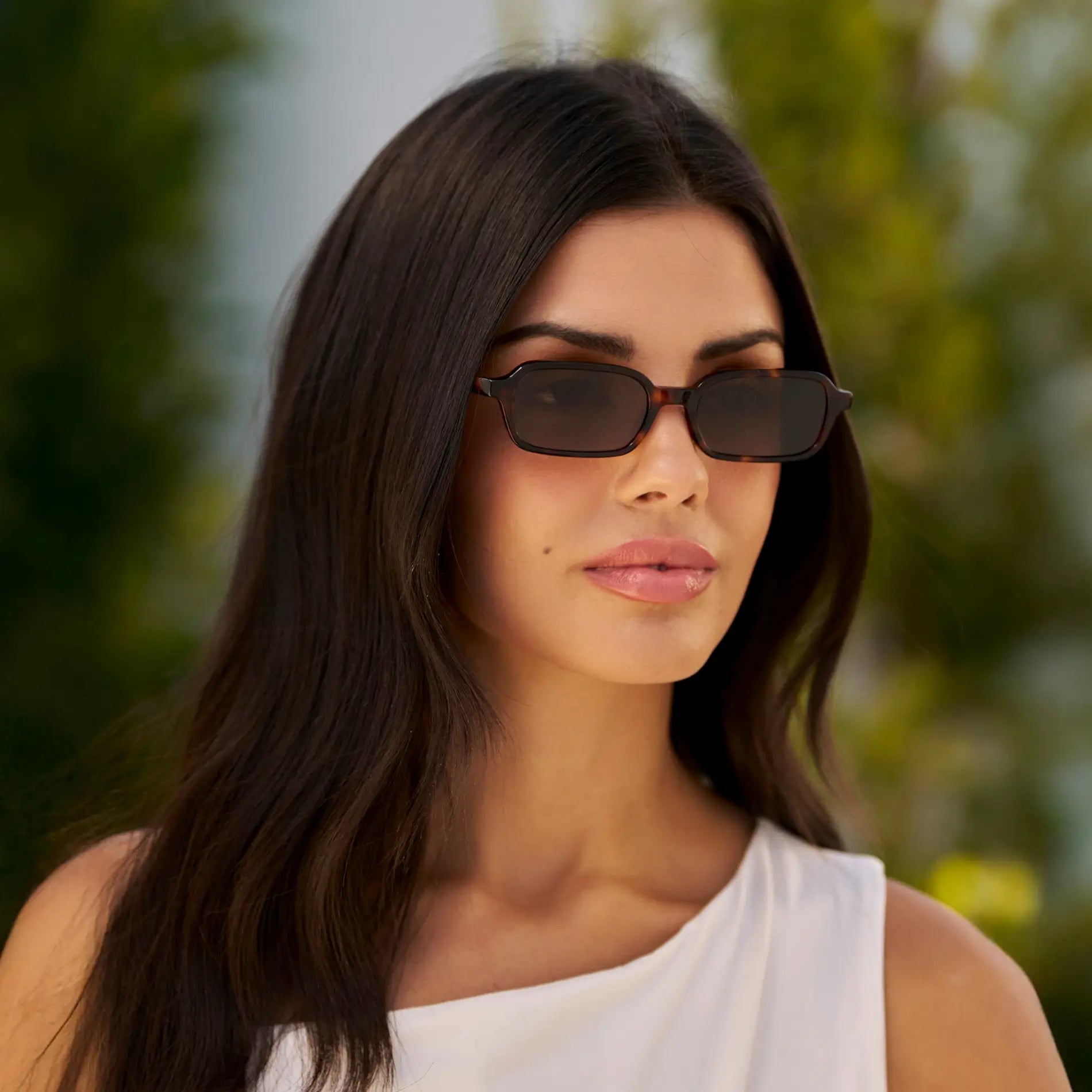 Brown Tortoise / Brown Lens || Model wearing Women's Rectangular Sunglasses with Brown Tortoise Frame and Anti-Reflective Brown Lenses