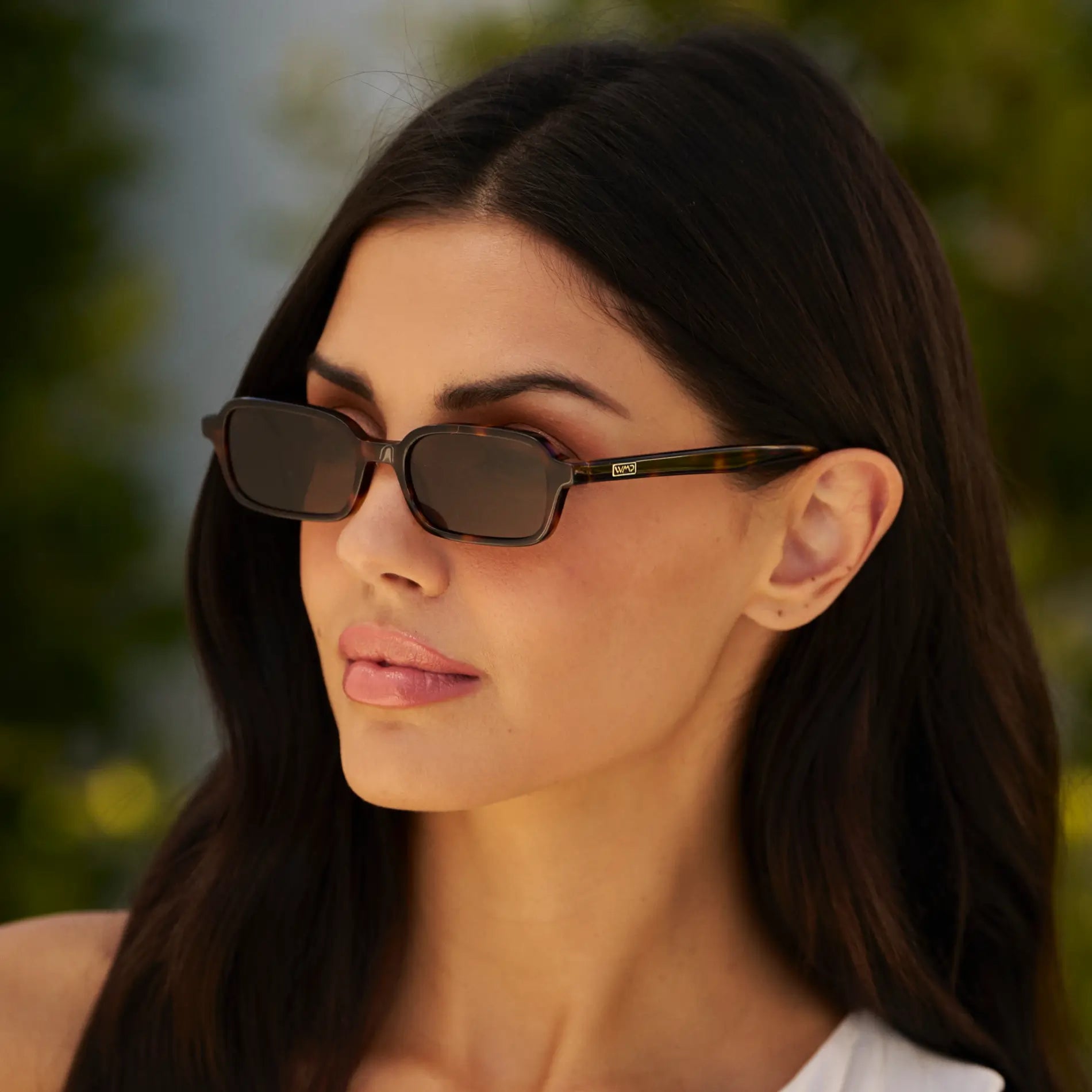 Brown Tortoise / Brown Lens || Model wearing Women's Rectangular Sunglasses with Brown Tortoise Frame and Anti-Reflective Brown Lenses