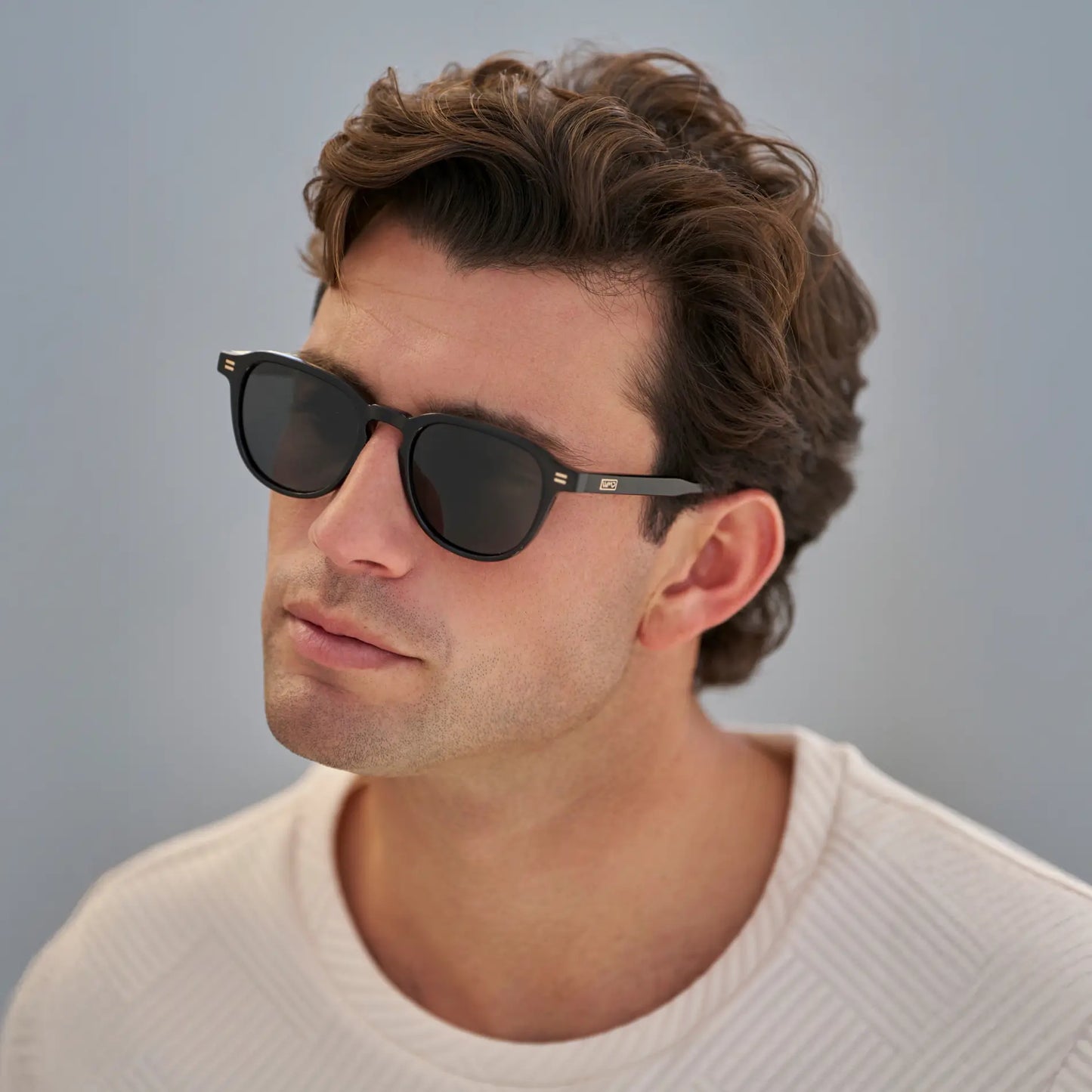 Black / Triple Black Lens || Model wearing Men's Round Polarized Sunglasses with Black Frame and Black Lenses